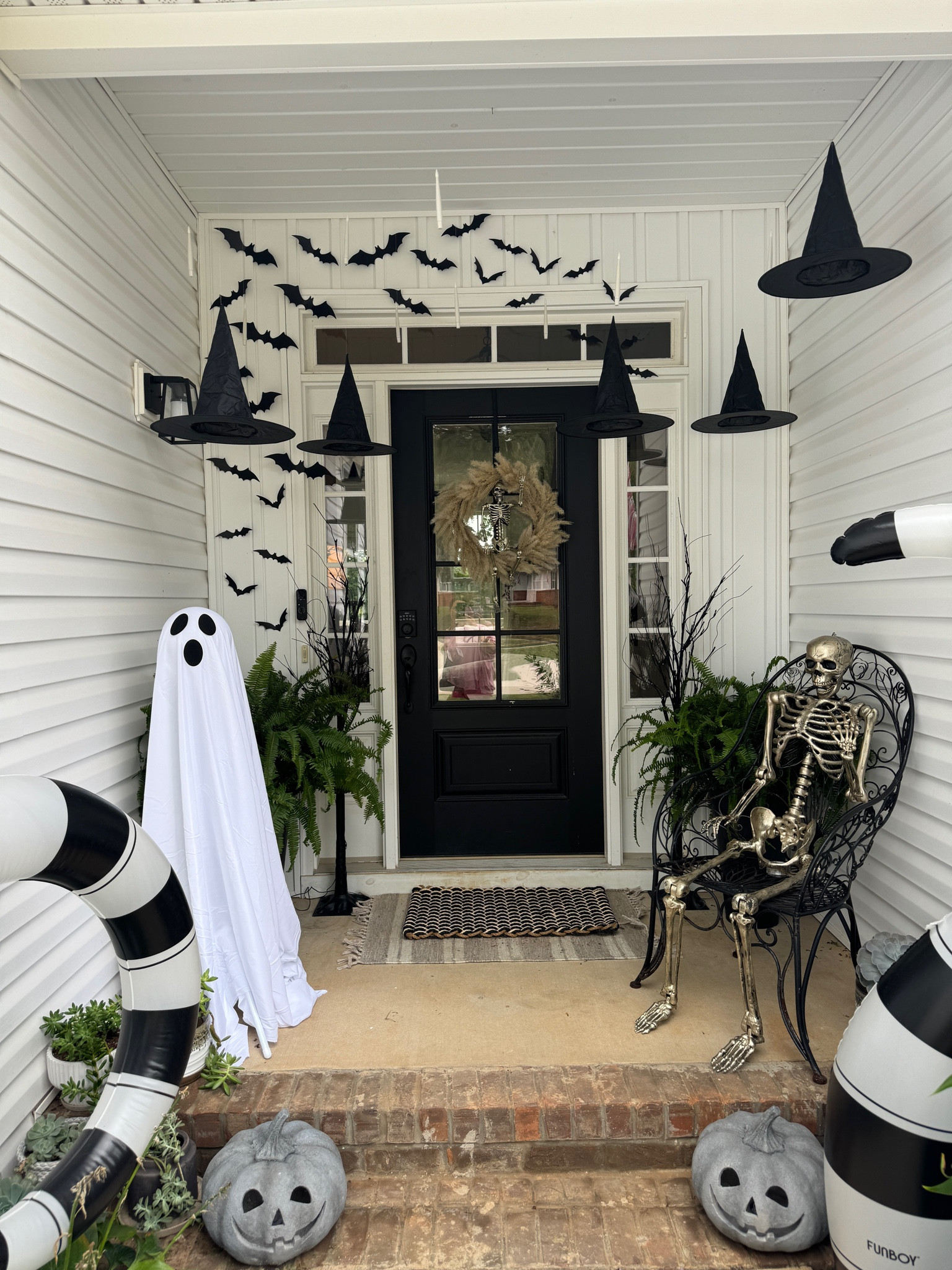 Halloween front porch decor 
Inflatables are funboy
Ghosts, witch hats. Bats and candles are Amazon
Skellys, wreath are target 
Light up trees and pumpkins are home goods 

#LTKSeasonal #LTKHome #LTKFamily