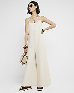 Cream textured button jumpsuit | River Island (UK & IE)