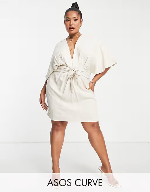 ASOS DESIGN Curve batwing tie front linen mini dress in natural window.asos.performance.markAndMe... | ASOS (Global)