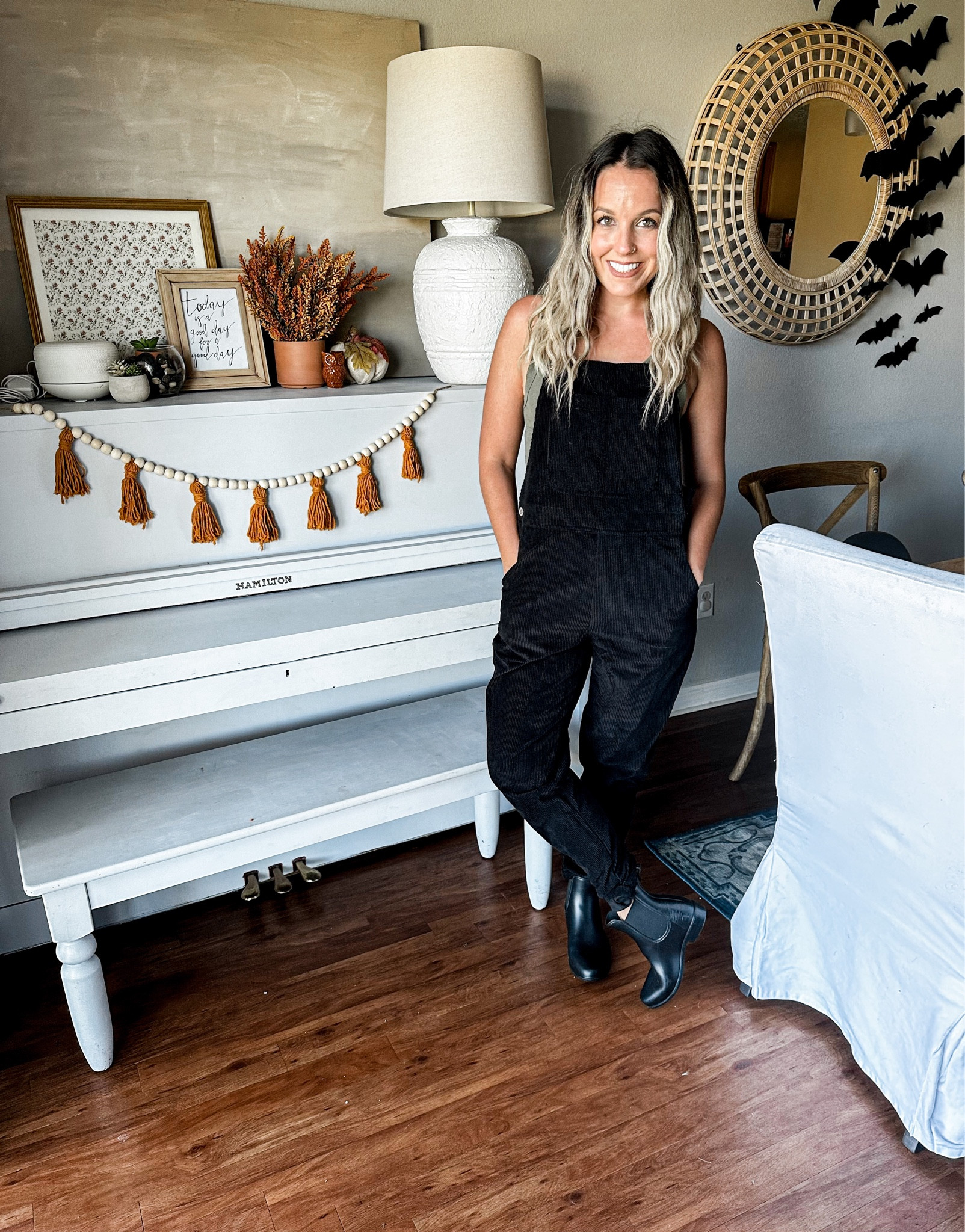Black ribbed corduroy overalls with olive green tank top and black rain boots 

#LTKshoecrush #LTKstyletip #LTKSeasonal