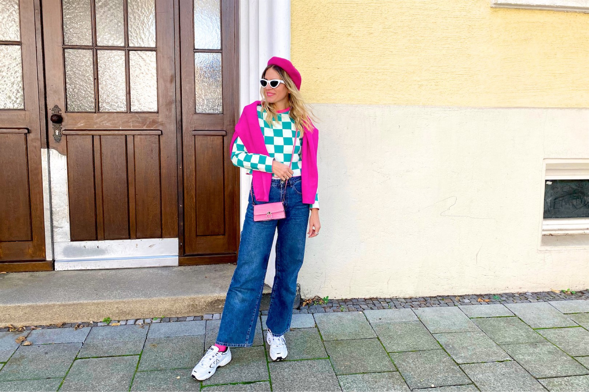 Pink Check Board. Fashion Blogger Girl by Style Blog Heartfelt Hunt. Girl with blond hair wearing a pink beret, pink sweater, check board sweater, white cat-eye sunglasses, wide leg jeans, pink mini bag and New Balance sneakers. #colorfuloutfit #colorfulstyle #colorfulfashion #colorfullooks #fashionfun #cutesummeroutfit #summerfashion2022 #summerlookbook #fitcheck #dailylooks #dailylookbook