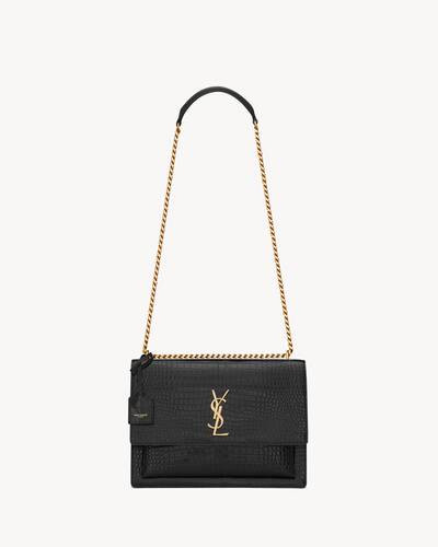 LARGE, LEATHER-LINED SUNSET BAG, WITH THE CASSANDRE AND DETACHABLE LEATHER CHARM. FUNCTIONAL AND ... | Saint Laurent Inc. (Global)