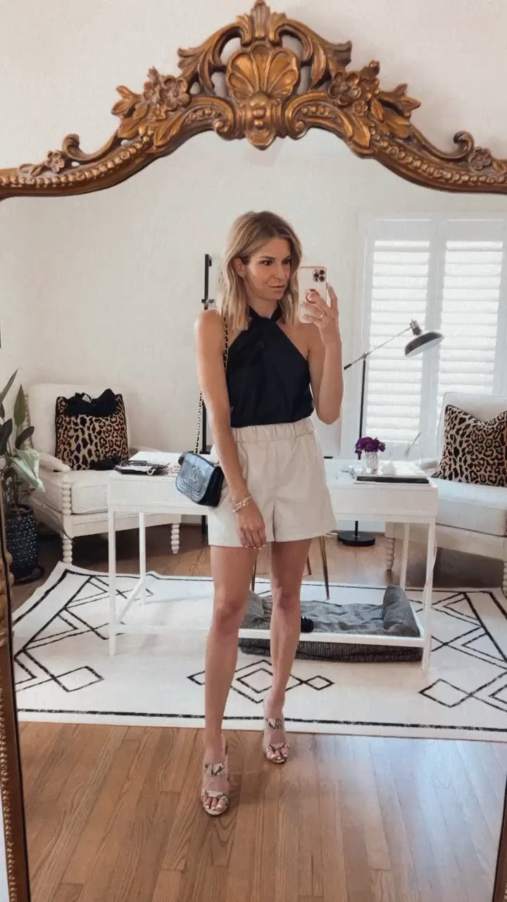 Similar faux leather shorts on sale at Shopbop! Similar black top and black purse. 

#LTKFind #LTKstyletip #LTKsalealert