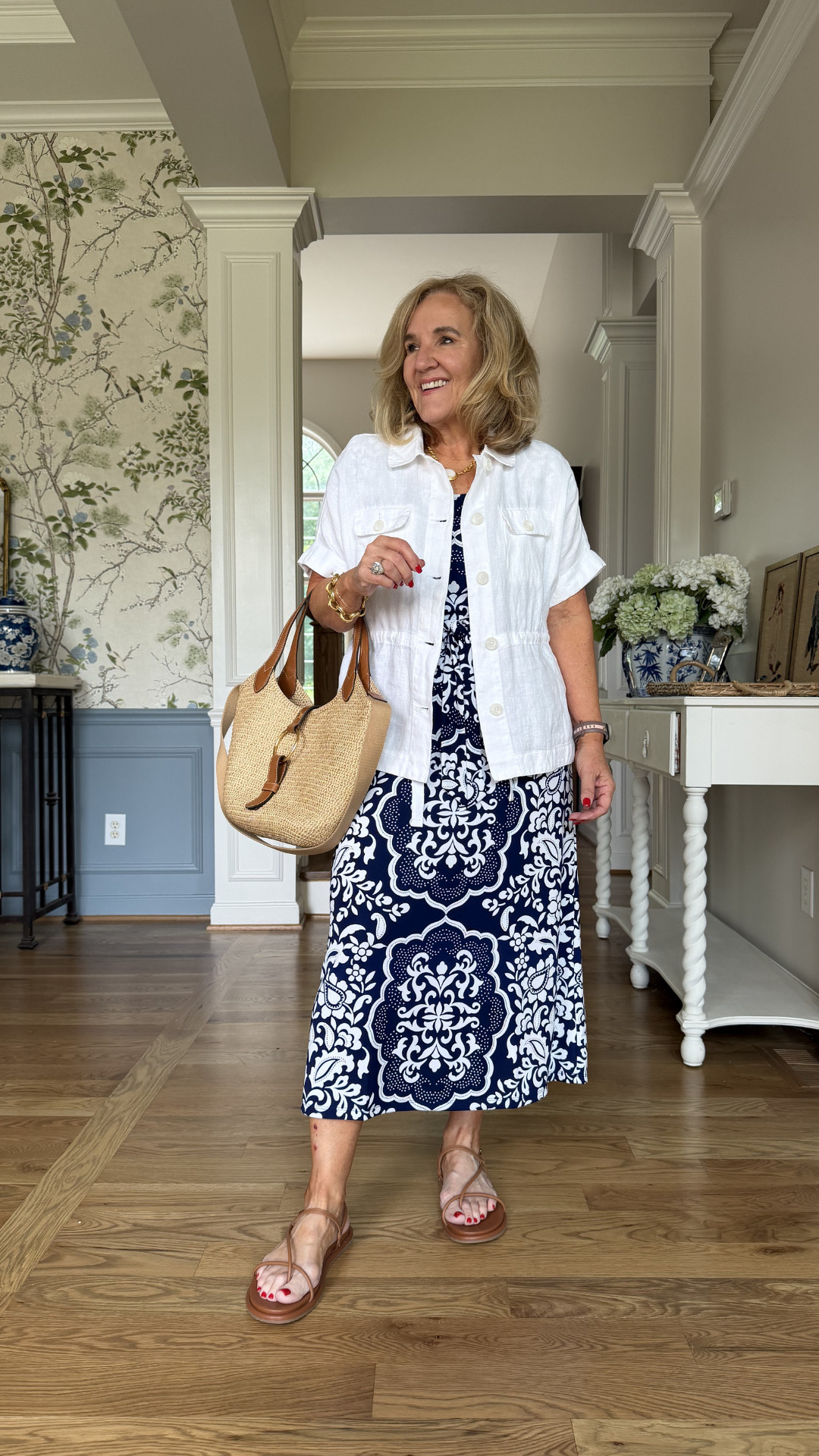A printed navy midi dress styled with a lightweight white jacket, flat sandals, and a woven tote for vacation days, casual dinners, weekend outings, and everyday summer plans 🫶🏻 

 #LTKootd #LTKSeasonal #LTKSaleAlert