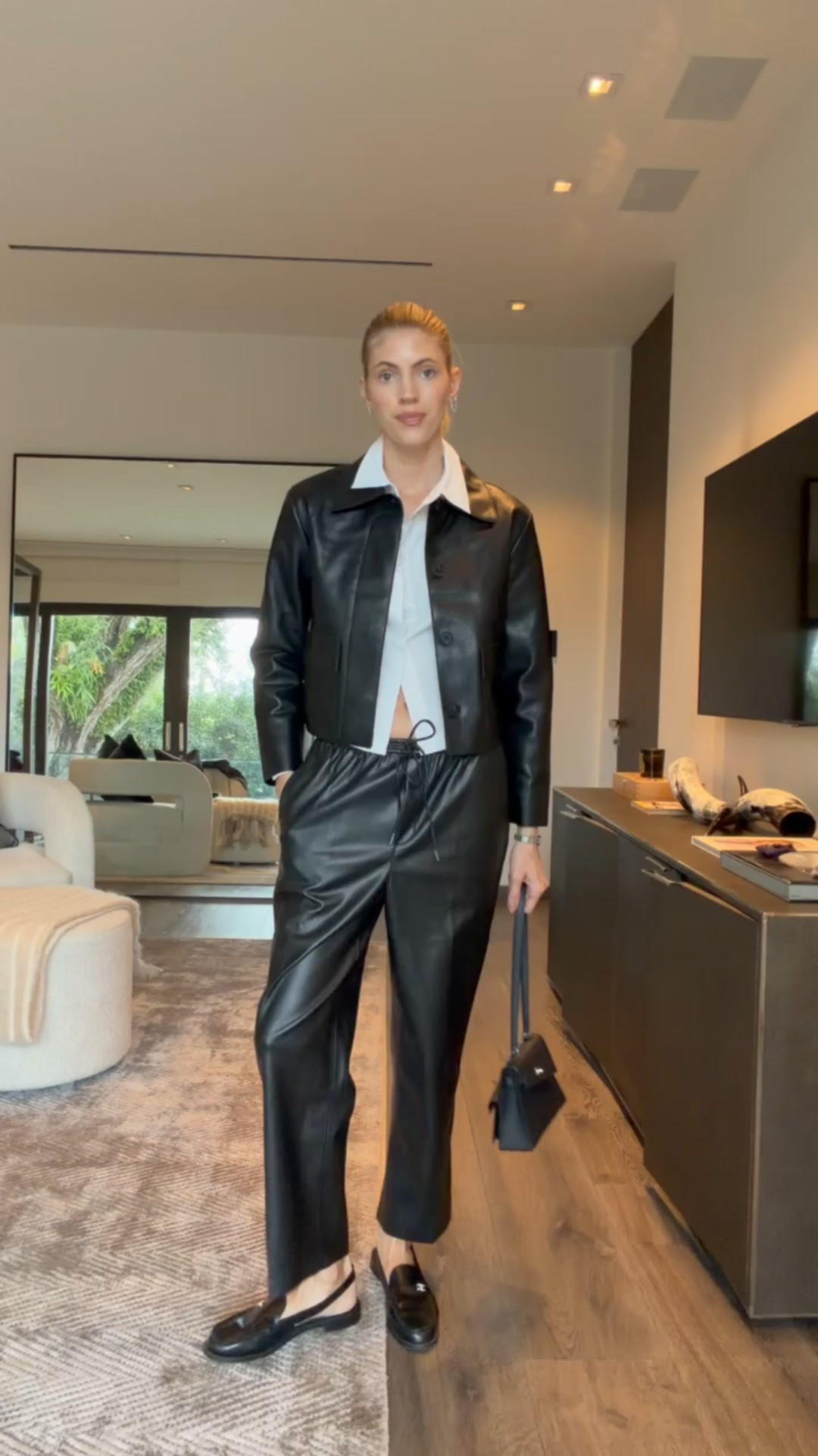 I love these faux leather black trousers from Mango! They have an elastic waistband and are super comfortable. 🖤 

#LTKSeasonal #LTKgrwm #LTKootd