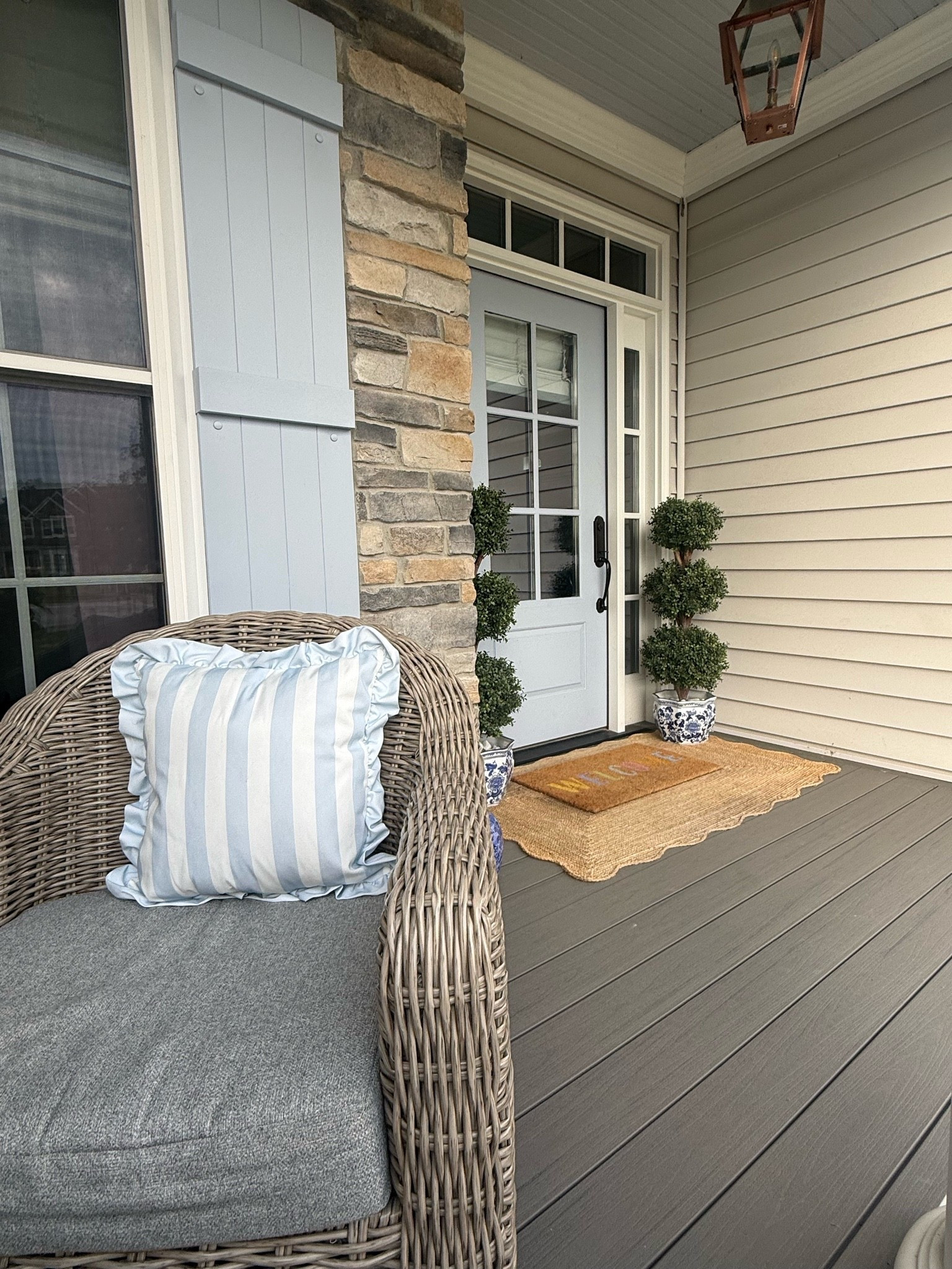 Front porch grandmillennial outdoor swivel chair, ruffle, blue and white, striped pillow, scalloped, jute rug, top Aries, blue and white outdoor planters ￼

#LTKSaleAlert #LTKHome #LTKOver40