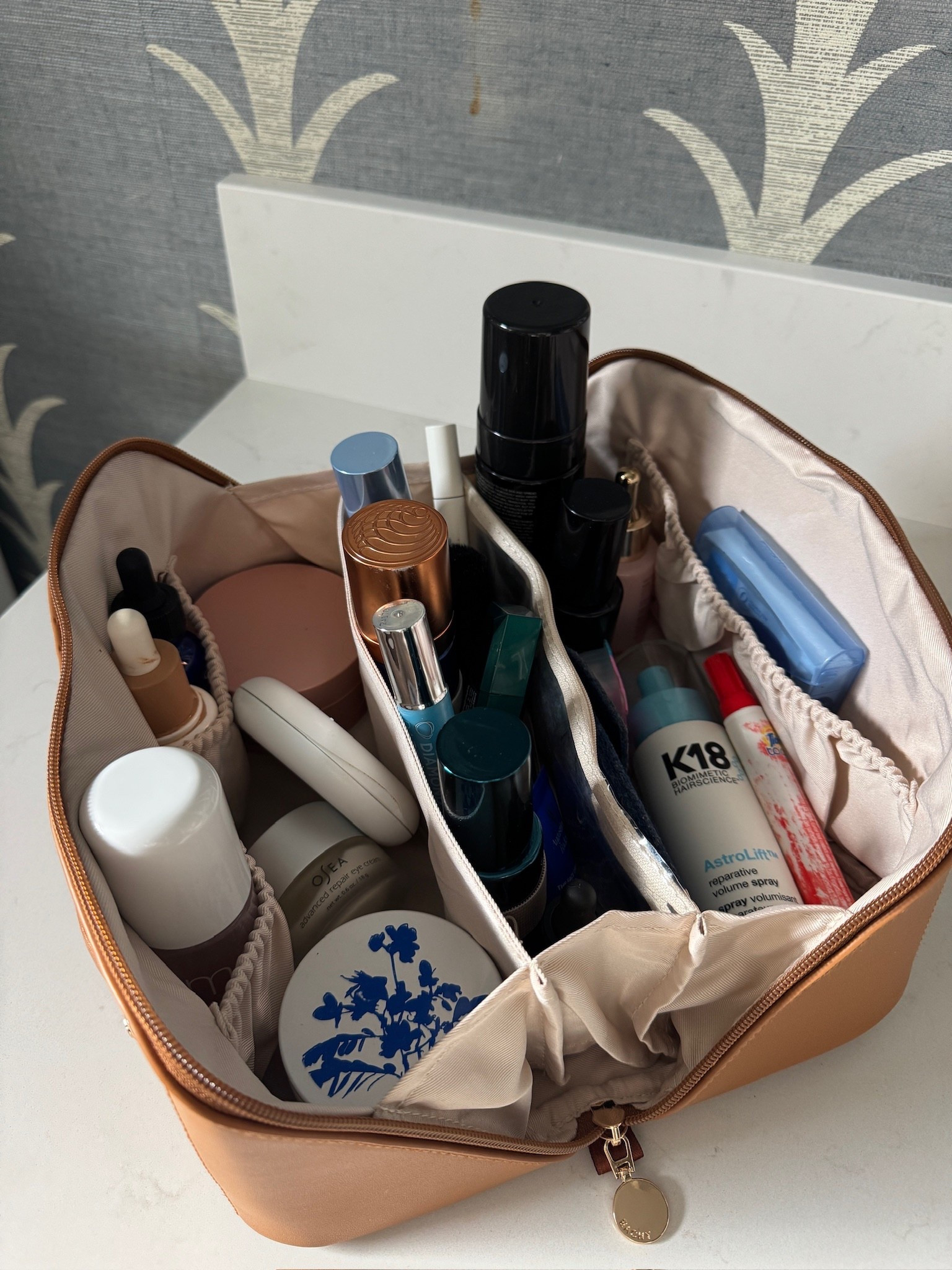 Recently shared my travel essentials and this makeup bag is actually that good! I’ve been living out of a suitcase lately and it’s the only thing keeping my skincare/beauty from turning into chaos. Holds a ton, stands upright, and makes counters feel organized again. 10/10 rec. 🤍

#LTKTravel #LTKselfcare #LTKgrwm