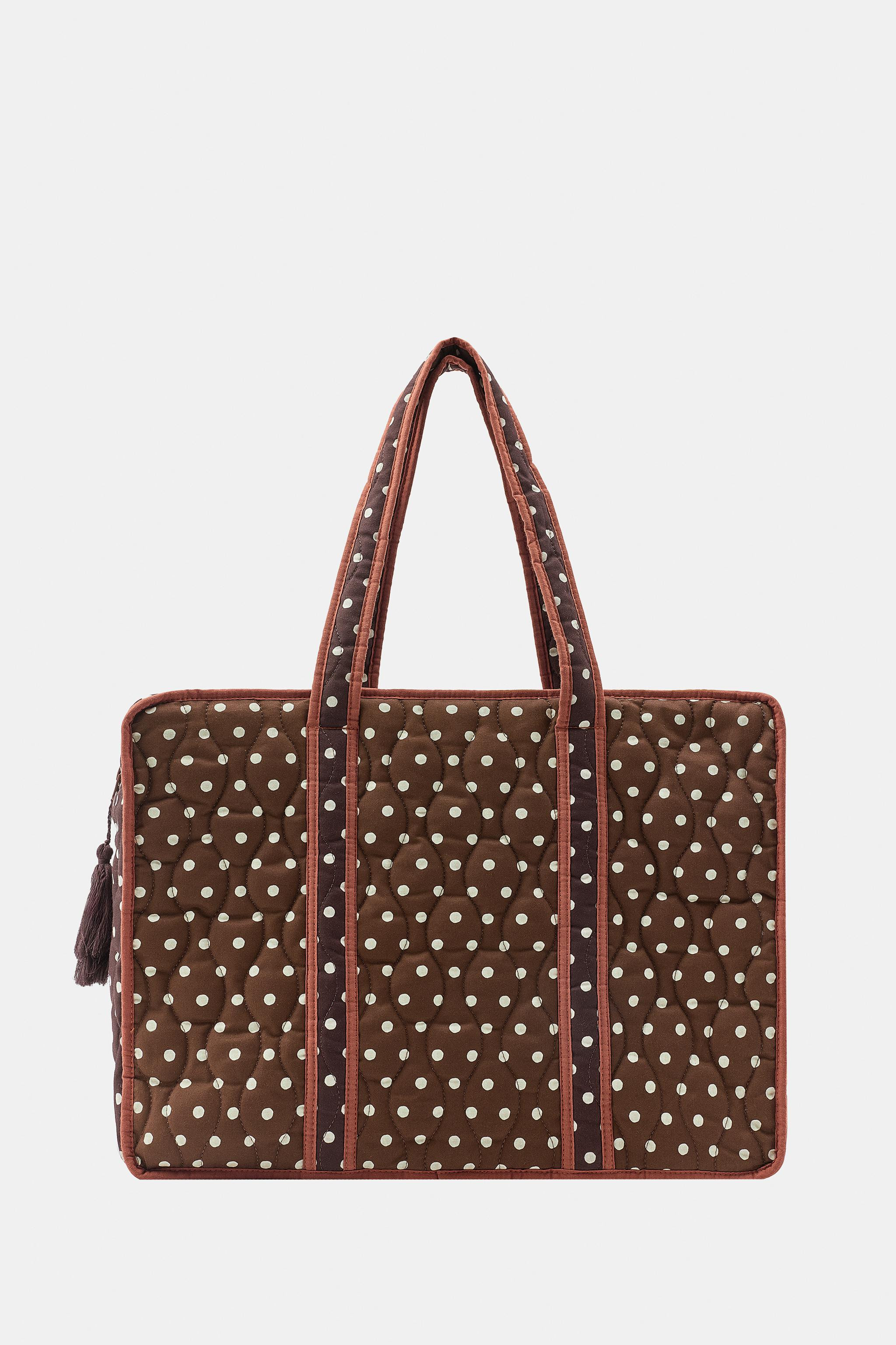 Rectangular printed bag crafted from 100% cotton yarn. Shoulder straps. Quilted fabric detail. Co... | Zara US