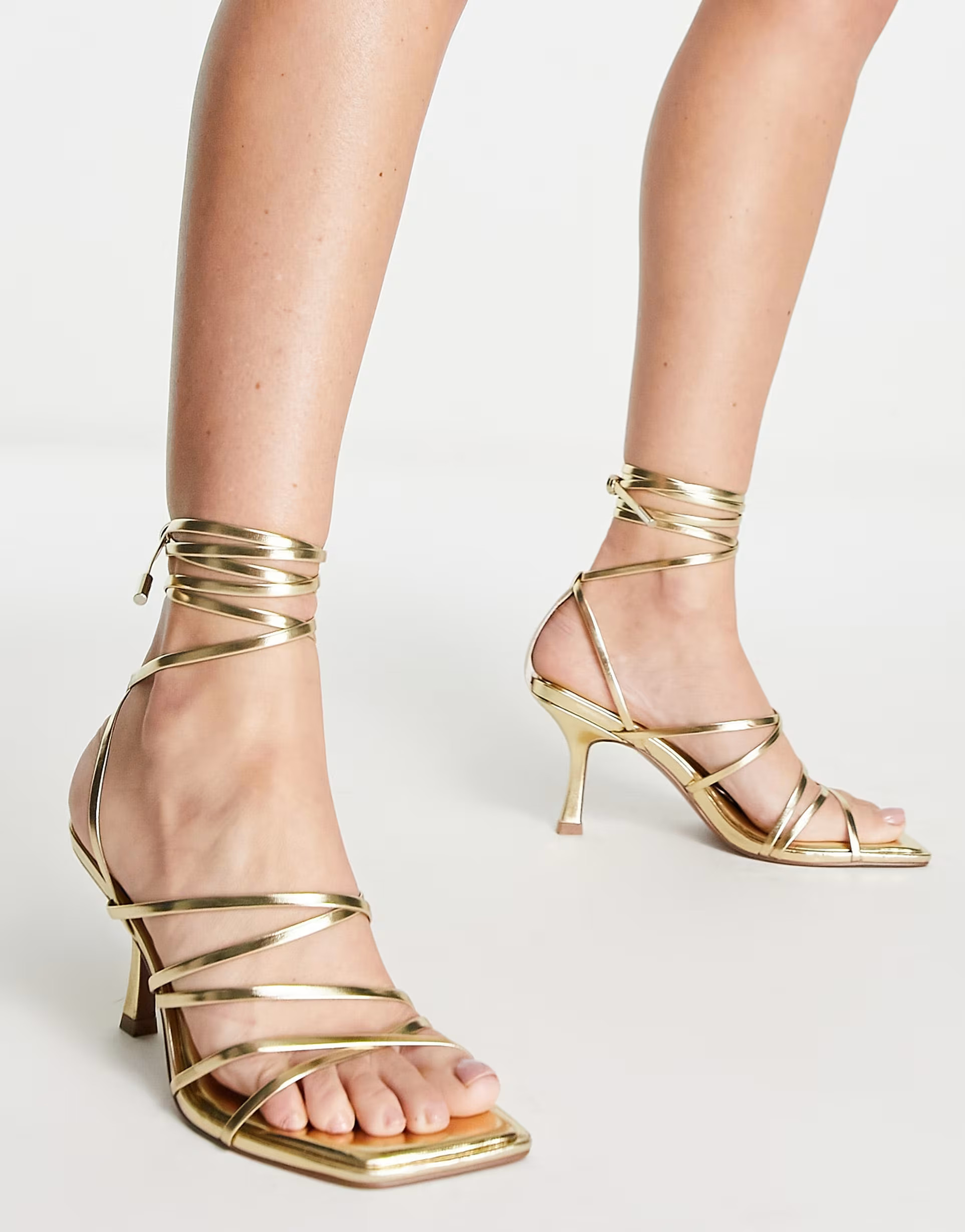 ASOS DESIGN Hiccup strappy tie leg mid heeled sandals in gold | ASOS (Global)