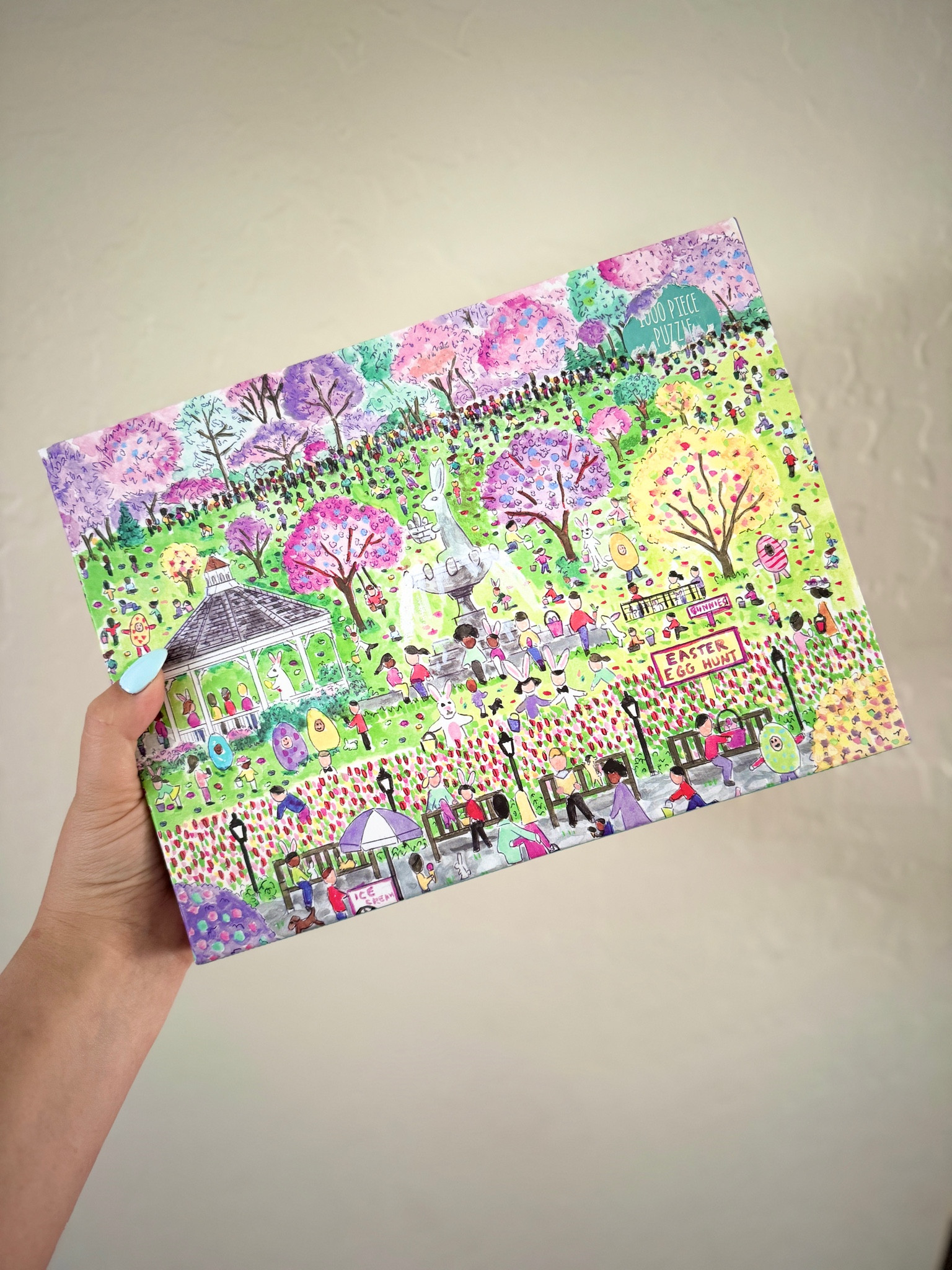 1000 PIECE PUZZLE – Michael Storrings Easter Egg Hunt Puzzle perfectly captures the spirit of Easter festivities with lawns full of happy children. This puzzle is just the right level of challenge for the whole family to join in on for hours of puzzling fun! The box includes an insert with the full puzzle image for reference.
BRIGHT AND BOLD ARTWORK – This puzzle features a charming scene in a whimsical park full of sherbet colored trees, an Easter bunny water fountain, puppies, and bunnies galore. Puzzle lovers will appreciate all the springtime details as they put together the image of the city with all its happy children, colorful eggs, and a gazebo on a sunny lawn.
PERFECT FOR GIFTING – Whether you're looking for a fun activity for a rainy day or a unique gift for an Easter gift basket, this puzzle is sure to impress! With its intricate details and challenging design, this puzzle is perfect for anyone who loves Easter or puzzles. The puzzle's high quality painted image of a Easter egg hunt in the springtime makes it a beautiful and eye-catching addition to any home or office.
EASY HANDLING – The 1000 ribbon cut puzzle pieces are thick and sturdy. The completed puzzle measures 20” x 20”. Puzzle greyboard contains 90% recycled paper. Packaging contains 70% recycled paper and is made responsibly from FSC-certified material. Printed with nontoxic inks.

#LTKhome #LTKsalealert #LTKparties