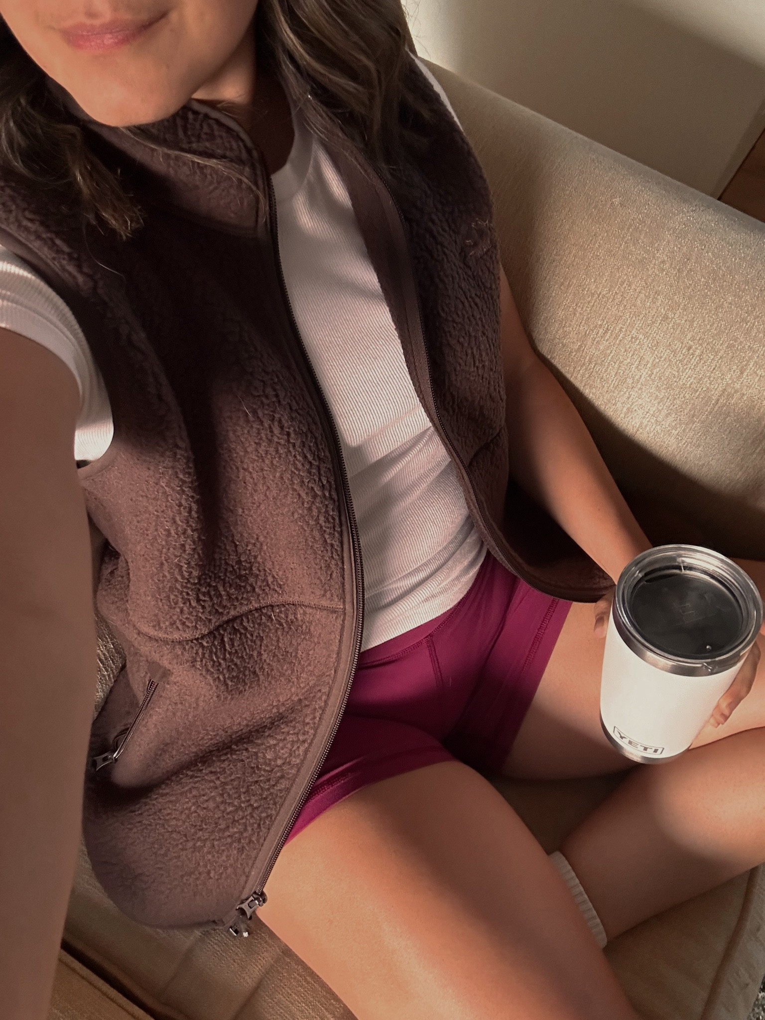 Comfy casual fall outfit idea: cranberry bike shorts paired with a comfy white t-shirt and fleece vest. 

#LTKstyletip #LTKfitness #LTKcanada