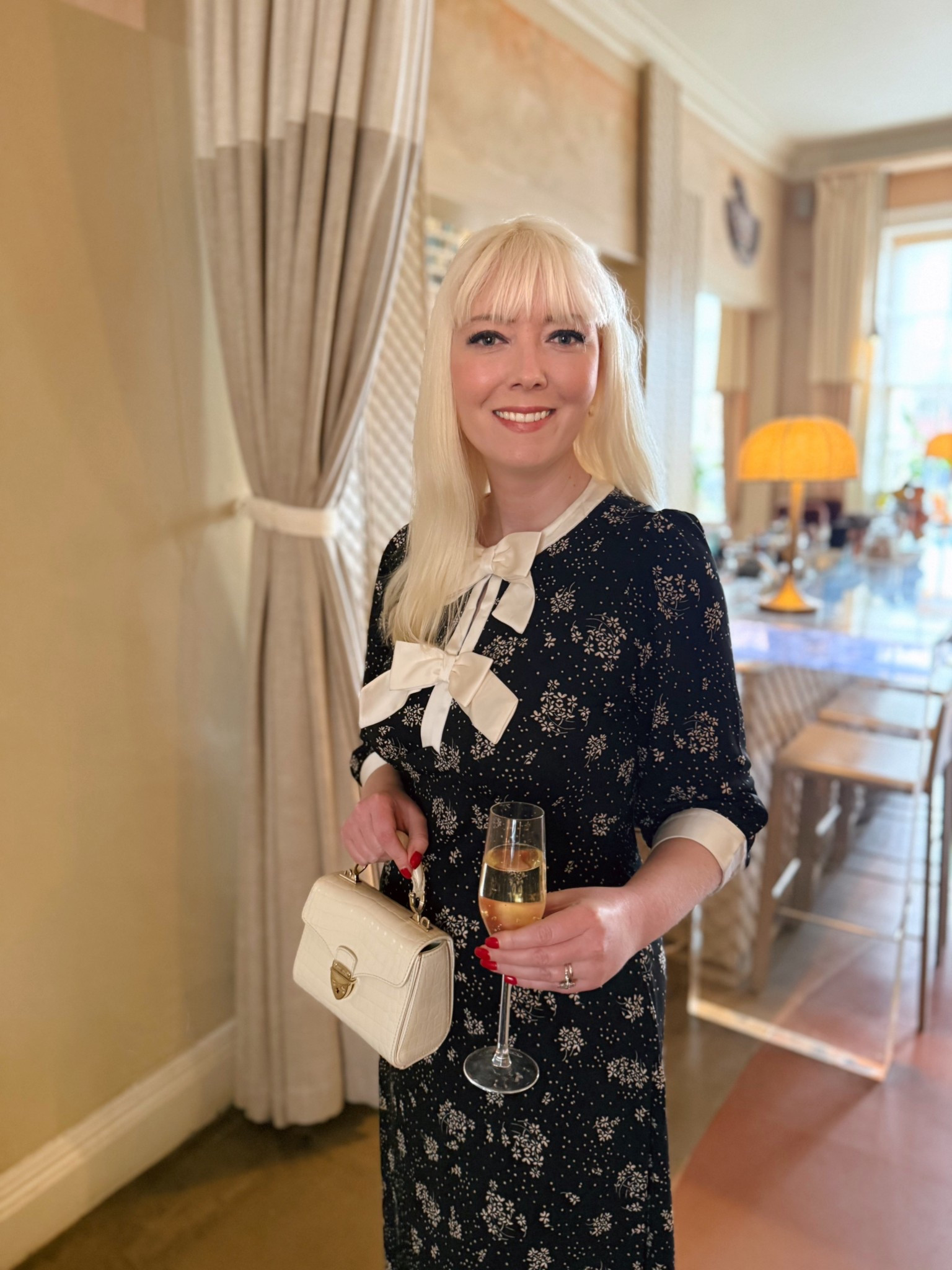 Parisian vibes always! This is the fab ‘Dotty bow floral jersey midi dress’ in black from Monsoon’s SS26 collection & at £75 it’s a total steal! I partnered with ivory accessories - including the Mini Mayfair Bag by Aspinal of London - to complement the oversized bowz and contrast detailing on the neckline and sleeves.

#LTKeurope #LTKspring #LTKuk