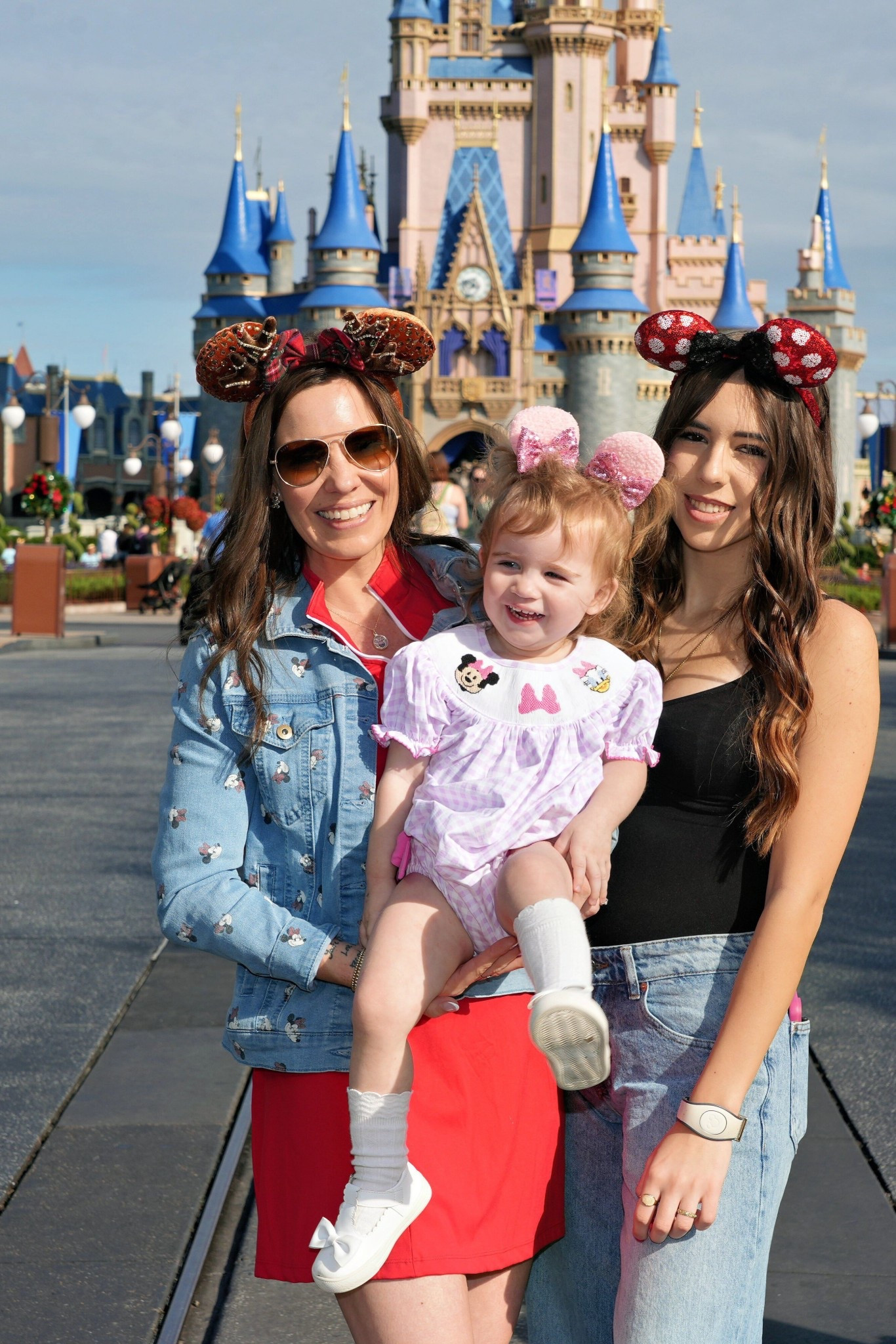 🏰 Disney Days with My Girls ✨ Two Generations of Minnie Magic 🎀

Making memories in front of Cinderella’s Castle with my girls 💕 There’s nothing sweeter than sharing Disney magic together — matching Minnie ears, smiles, and all! 🌟

I wore my Mickey & Friends denim jacket over a festive red tennis dress for a comfy park-day outfit that still feels holiday-ready. Paired with BaubleBar gingerbread Mickey earrings, Minnie reindeer ears, and DIFF Cruz sunglasses, it was the perfect mix of fun and polished! ❤️🎄

Caroline’s lavender smocked Minnie bubble from The Smocked Flamingo was pure sweetness, complete with white bow Stride Rite shoes, knee-high socks, and her sparkly pink Minnie clips. 🩷

🎀 Shop our looks:
	•	Mickey Mouse & Friends Denim Jacket – Disney Store ($89.99)
	•	Red Tennis Dress – Amazon ($37.99)
	•	Minnie Mouse Reindeer Ears – Disney Store ($39.99)
	•	BaubleBar Disney Christmas Earrings – Amazon ($34.00)
	•	DIFF Cruz Sunglasses ($89.00)
	•	Smocked Minnie Bubble – The Smocked Flamingo ($42.00)
	•	Stride Rite Baby Bow Shoes – Amazon ($35.00)
	•	American Trends Knee Socks ($6.00)
	•	Minnie Ear Hair Clips – Amazon ($9.00)

💫 Disney outfit ideas • Mommy & Me Disney • Mother-daughter Disney style • Disney World Christmas outfits • Minnie Mouse outfits • Castle photo ideas • Disney family looks • Matching Minnie ears • LTK Disney fashion • Holiday park outfits 🎅🏻✨

#LTKTravel #LTKFamily #LTKHoliday