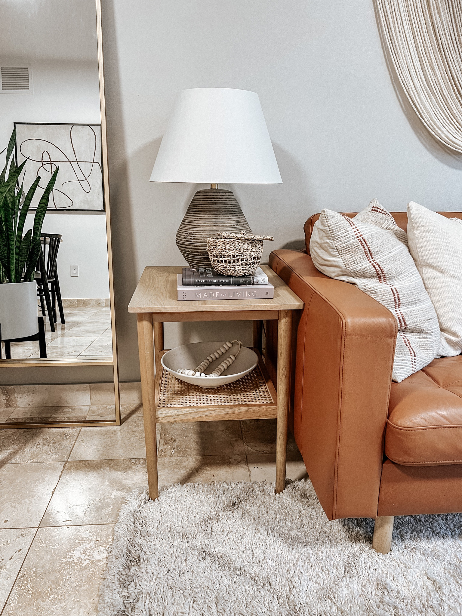 End table styling 

Ceramic lamp, ceramic bowl, decorative beads, books, small basket, affordable art, floor mirror 

#LTKhome