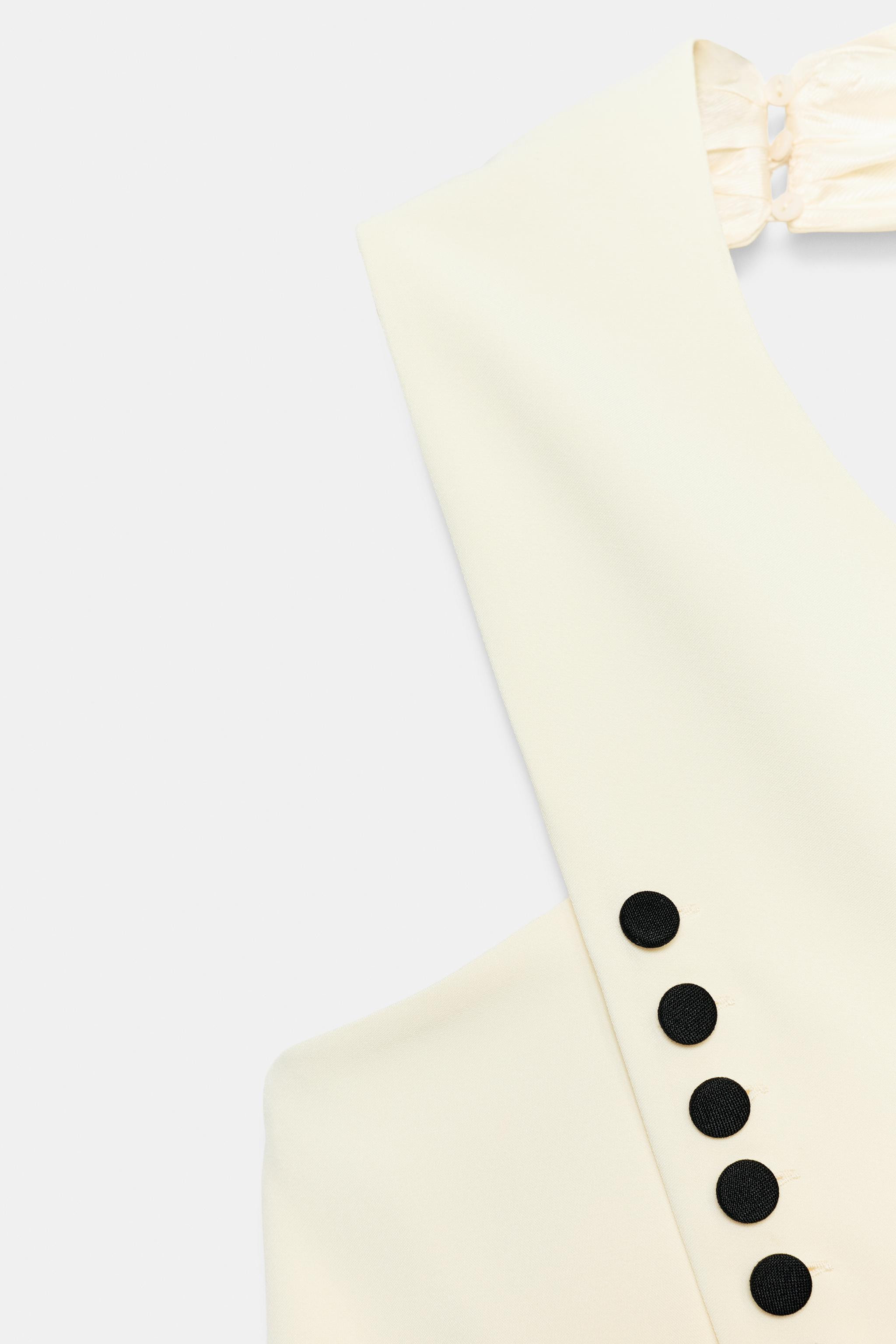 Halter neck vest with an open back. Front button closure and hidden back buttons. | Zara US