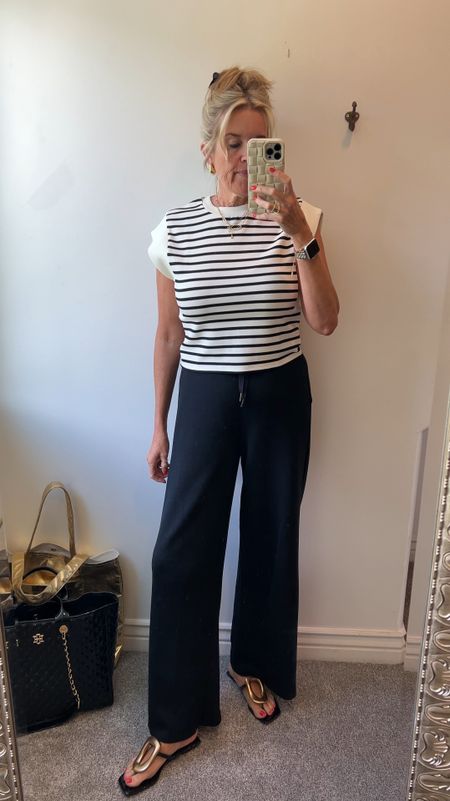 🚨promo code

🚨SAVE 10% off all Spanx with my CODE: DEARDARCYXSPANX

Spanx air essentials striped slightly crop cap sleeve top feels like butter
Perfect for Summer season comes in black and stripped tts 

Spanx air essentials wide leg black pants
Fits tts and do butter soft 

Jeffery Cambell gold embellished black sandal fits tts and I am obsessed with.. a really comfy sandal. Although flat it has padding 

Great outfit for travel

Gold earrings designer dupes & best sellers


#LTKVideo #LTKTravel #LTKStyleTip