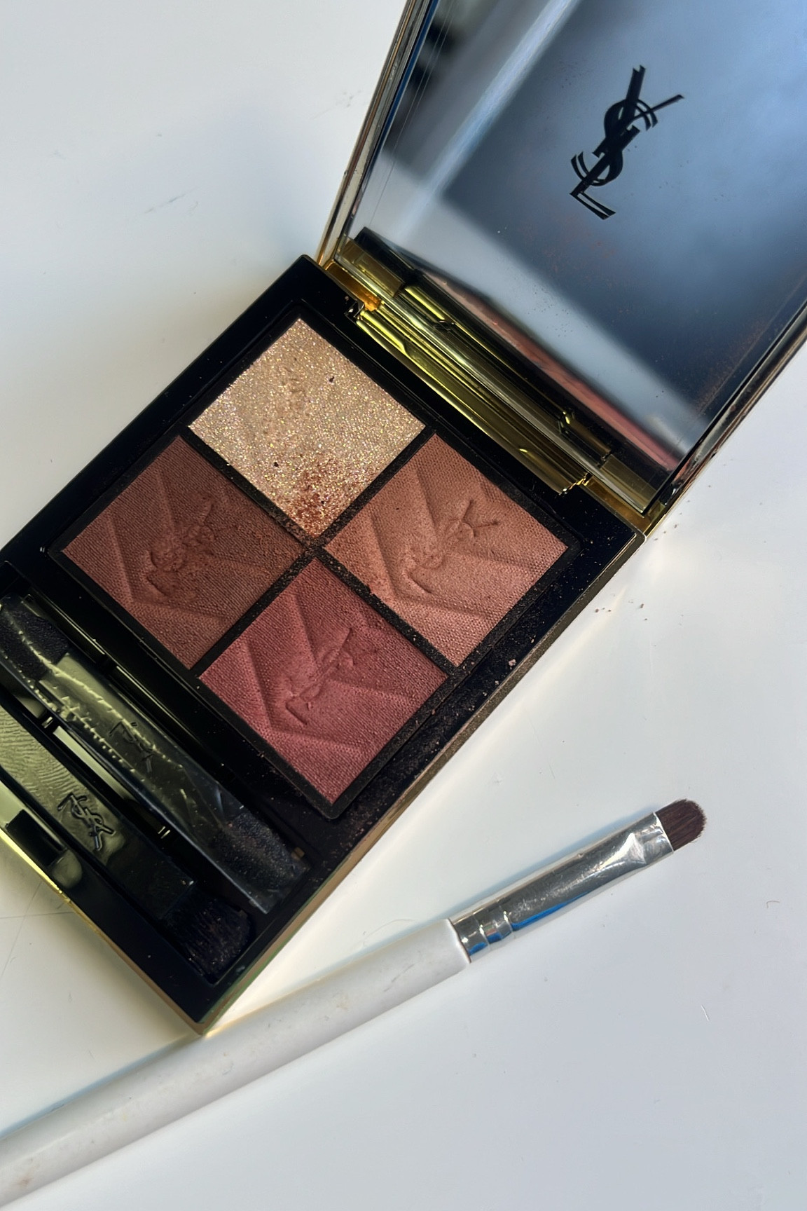 Eye shadow palette and winged shadow brush for $2 high low baby 

#LTKfindsunder50