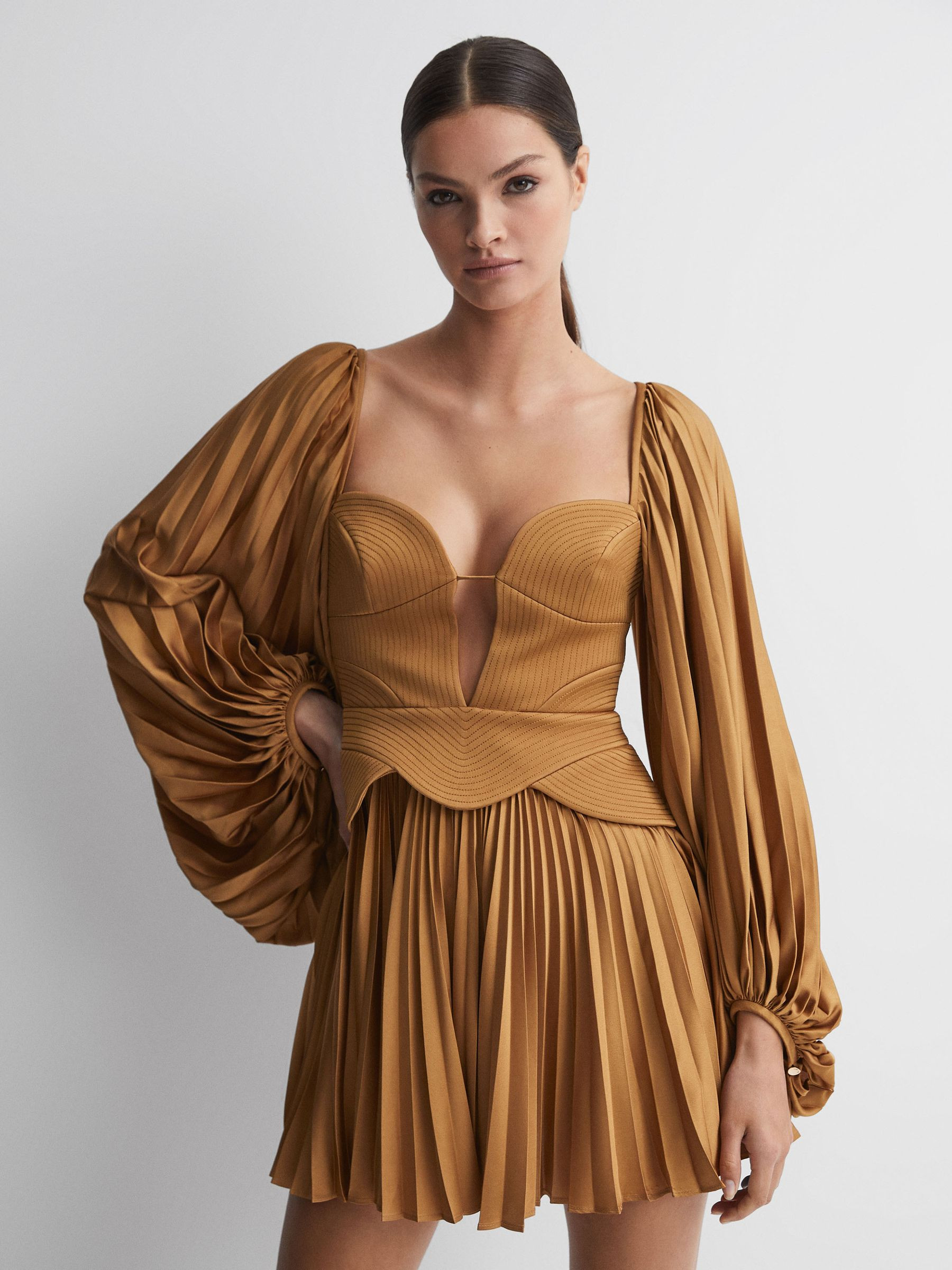 Acler Peplum Pleated Mini Dress in Gold | Reiss UK