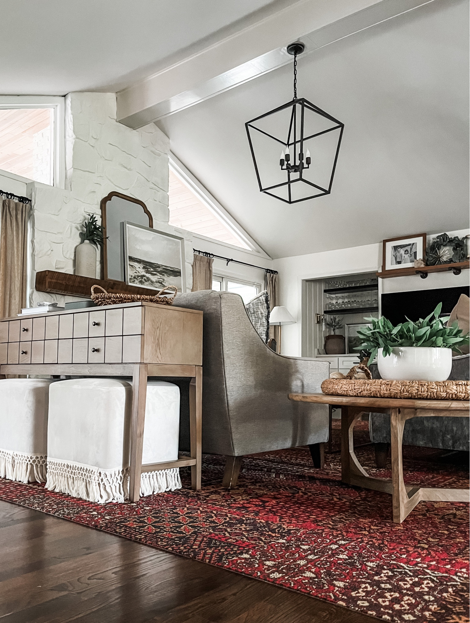 Living room views with the new rug by FLOR in Oasis Retreat Crimson. 

#console #ottoman #pendantlight #wallart #wallmirror #woventray

#LTKhome #LTKunder100 #LTKstyletip