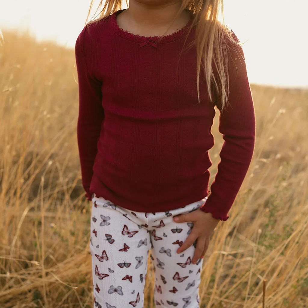 Solid Red Long Sleeve Burgundy Pointelle Lettuce Edge Shirt | Posh Peanut\u00ae | Posh Peanut