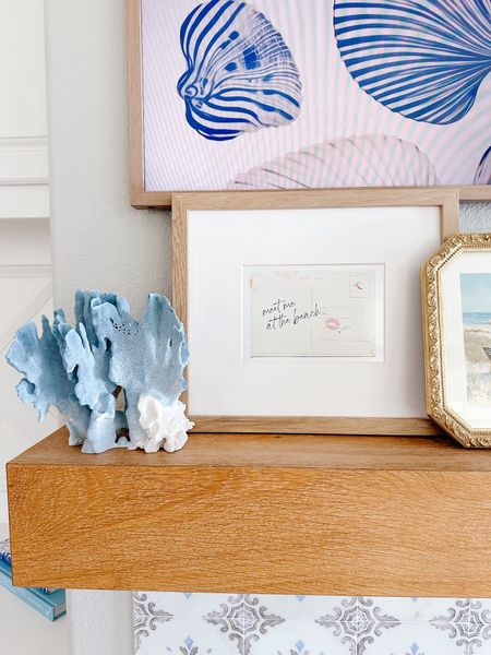Coastal Summer Mantel Styling 🩵🍊🐚- this shell tv art was screaming my name when I saw it. A fun way to switch things up for summer and is so easy to do is get printable art that give that summer feel. 