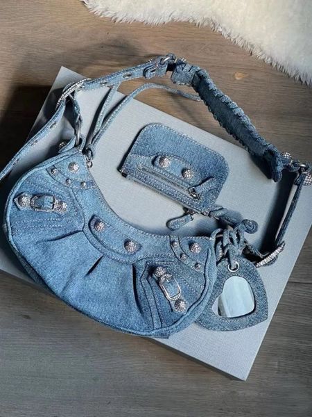Balenciaga bag. Blue denim hobo bag. Le Cagole  shoulder bag. Summer, spring, colorful bag. 
Y2K. Statement piece. Designer bag. Wardrobe staple. Timeless. Gift guide idea for her. Luxury, elegant, clean aesthetic, chic look, feminine fashion, trendy look. Farfetch. 

#LTKstyletip #LTKgiftguide #LTKbag