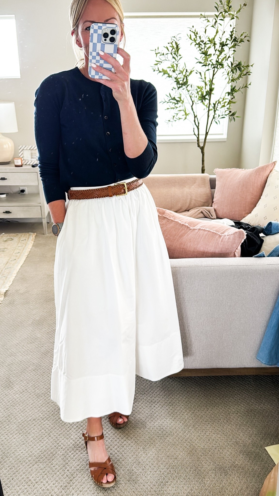 Off to a little gathering… put together this white skirt (old BR but I linked a super similar one) with my Old Navy sweater, a woven belt and heals. 

Linking the look below!
