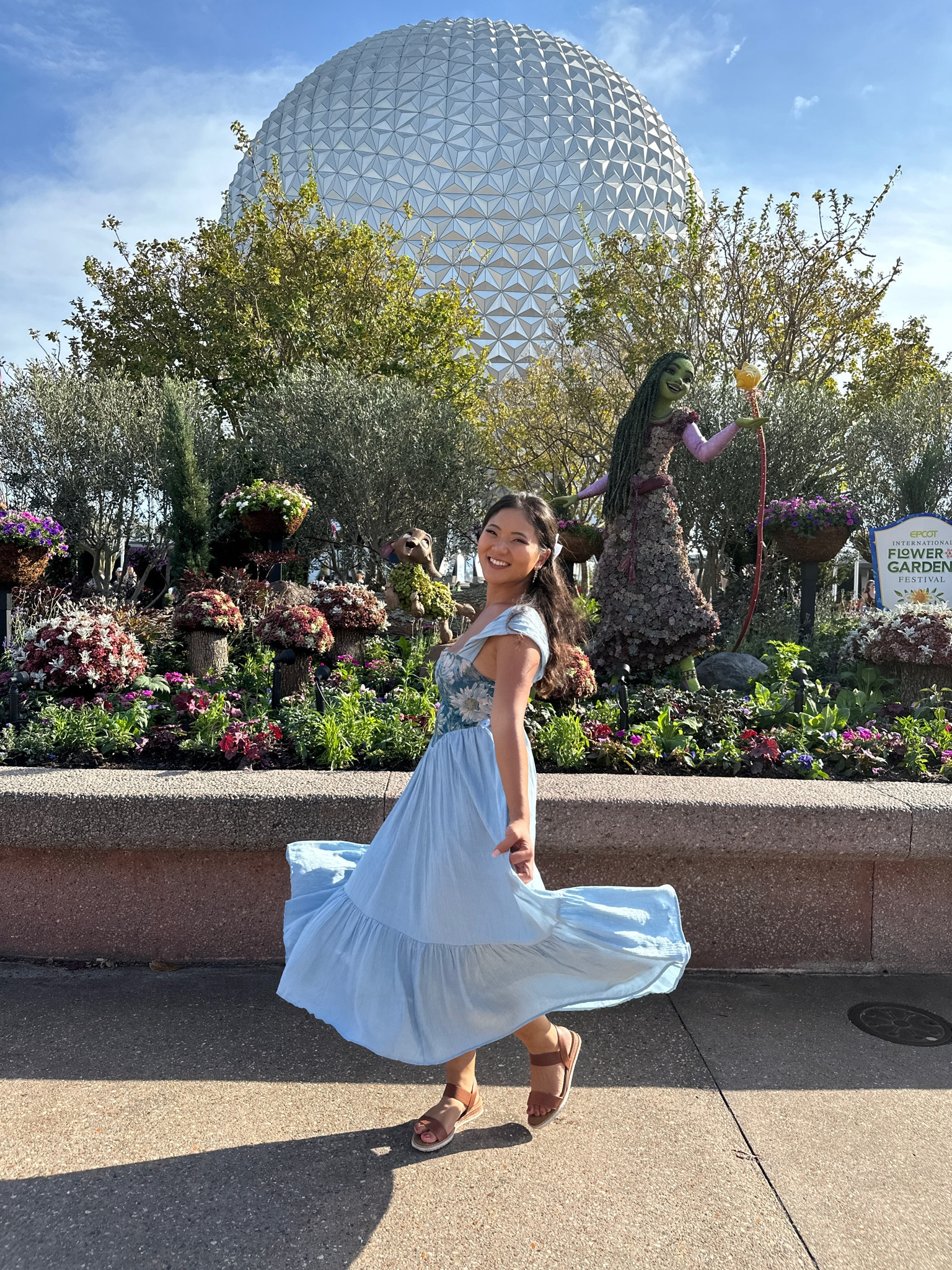 Disney Epcot Flower and Garden festival wearing a puff sleeve dress size up 