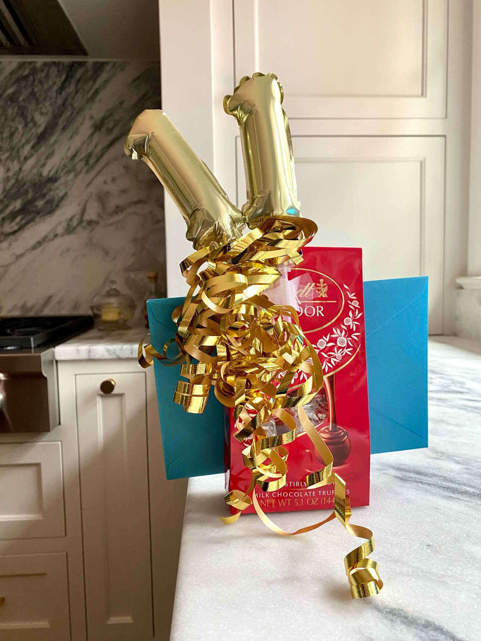 Current favorite birthday gift… yummy chocolate, fun number balloons, curly ribbon & a card with some cash. 

#LTKhome #LTKfamily #LTKkids