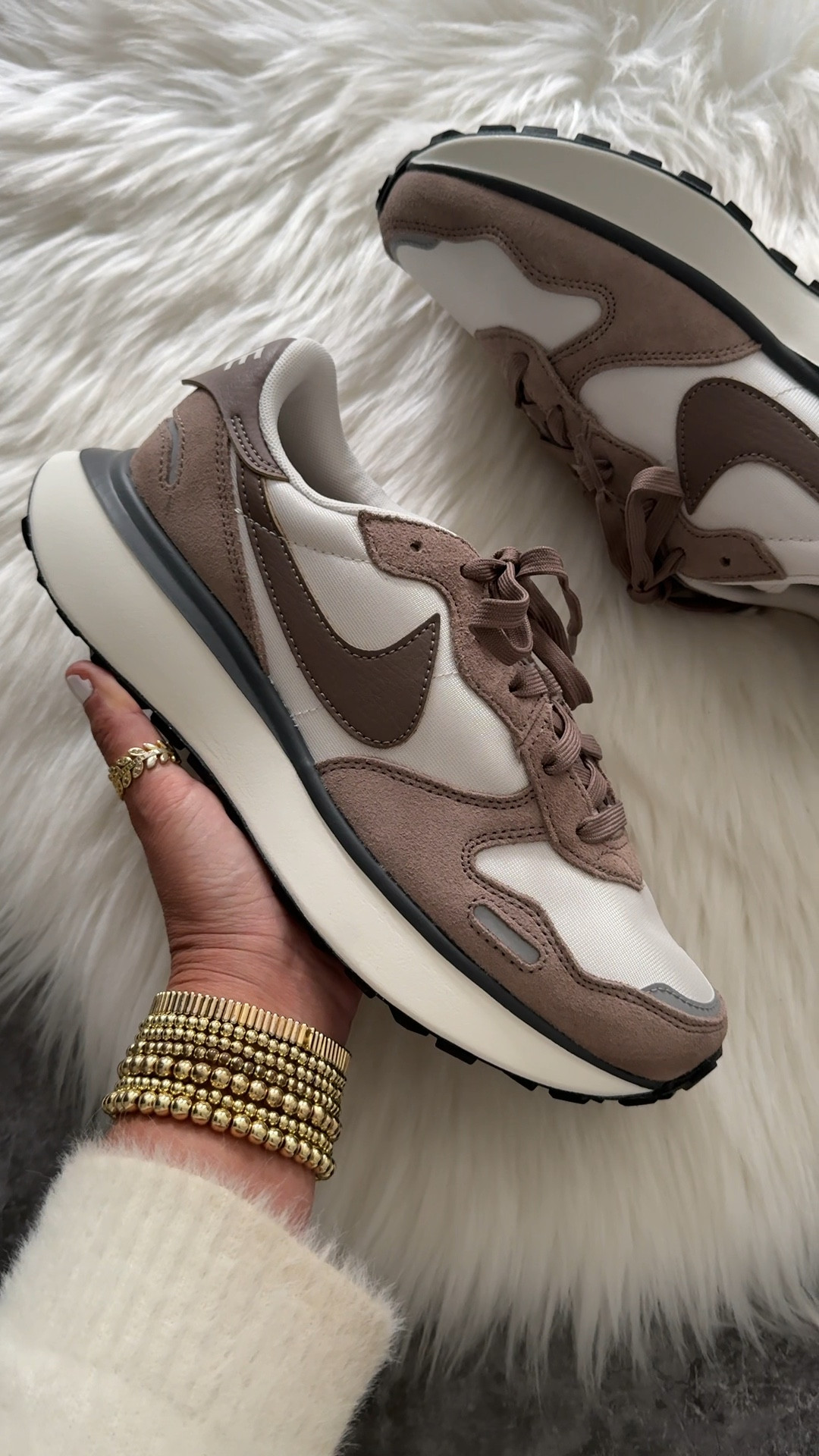 Nike phoenix waffle sneakers fit large. Go down a half size when ordering 