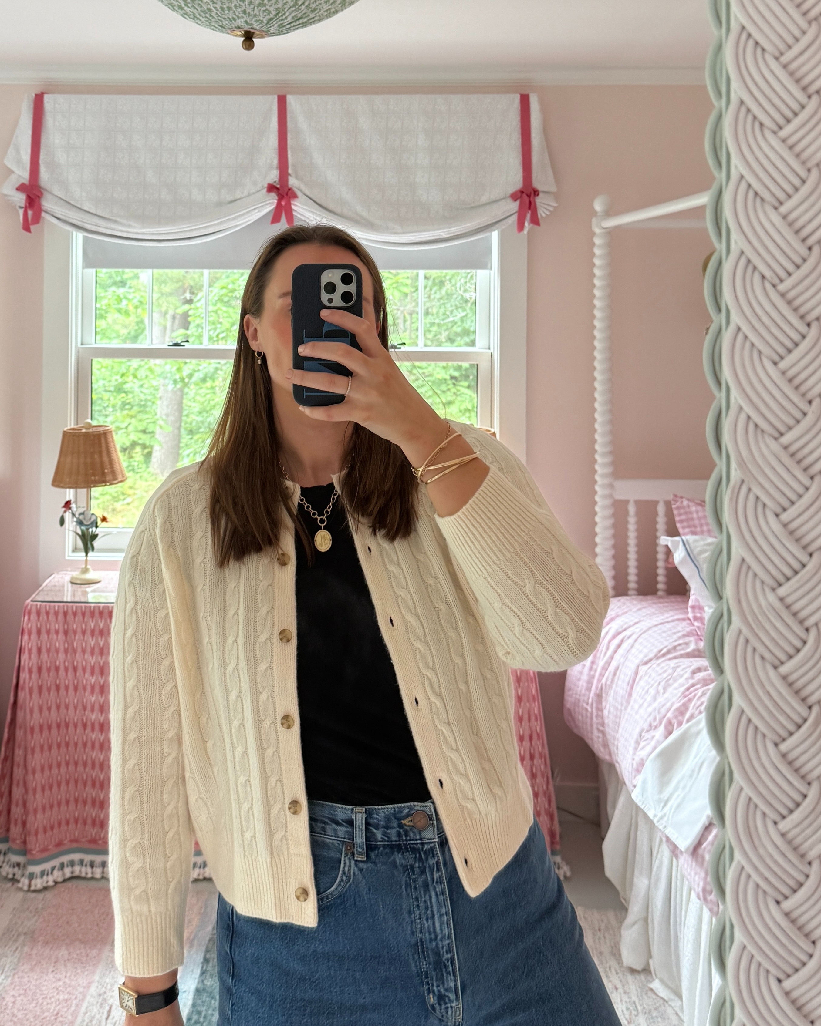 A easy classic everyday outfit with a Doen ivory Cableknit cardigan, a black t-shirt and classic high rise jeans. #classic #timeless #midsize #xl 

 