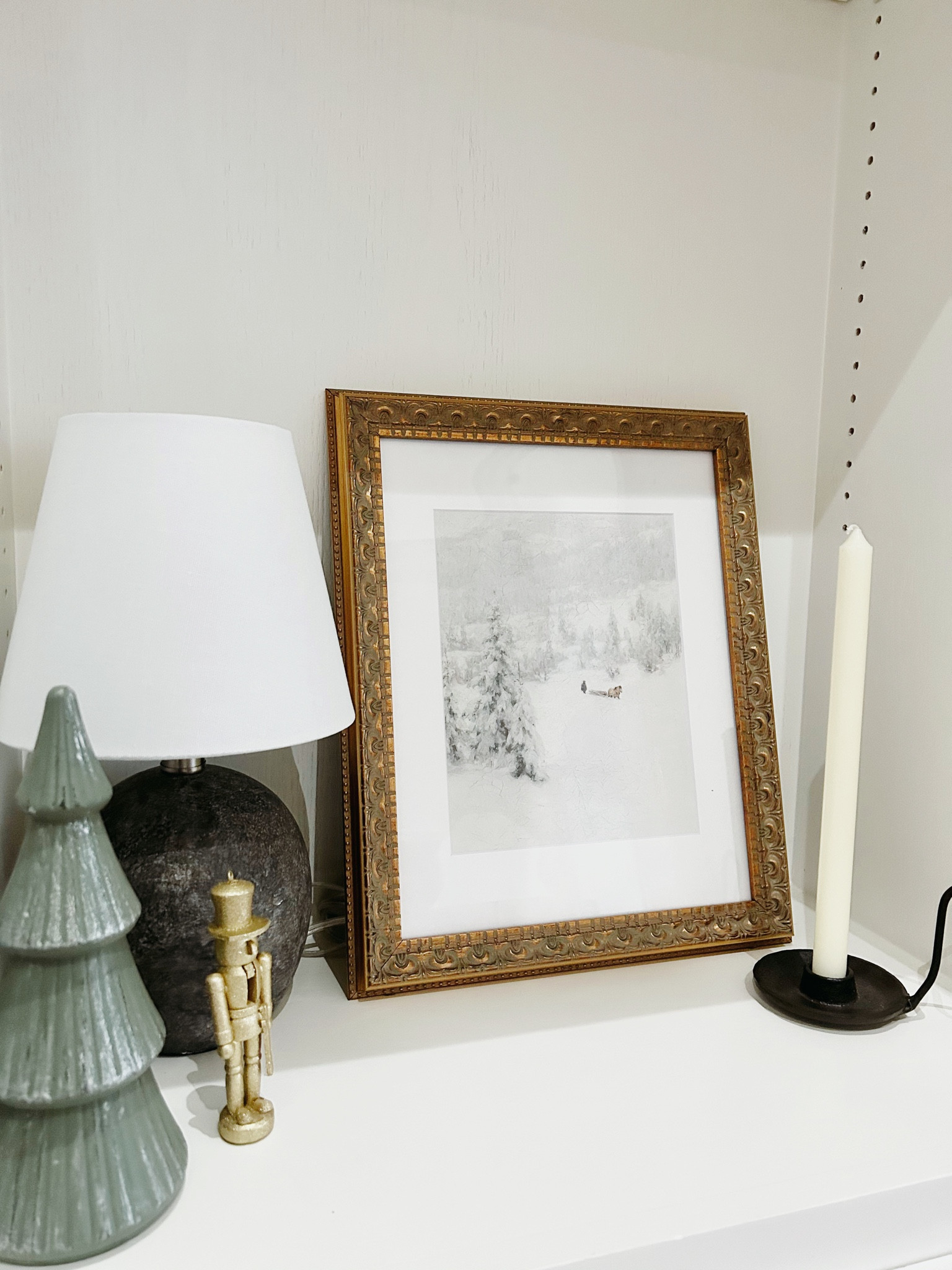 Shelf decor in my living room. 

Christmas tree decor, Christmas decor, holiday decor, modern decor, modern tree decor, nutcracker, gold nutcracker, glitter nutcracker, accent lamp, small lamp, gray lamp, lighting, lamp for living room, wall art, winter art, gold frame, vintage frame, printable art, digital download, candles, taper, iron taper holder, gift ideas, home decor

#LTKSeasonal #LTKhome #LTKunder50