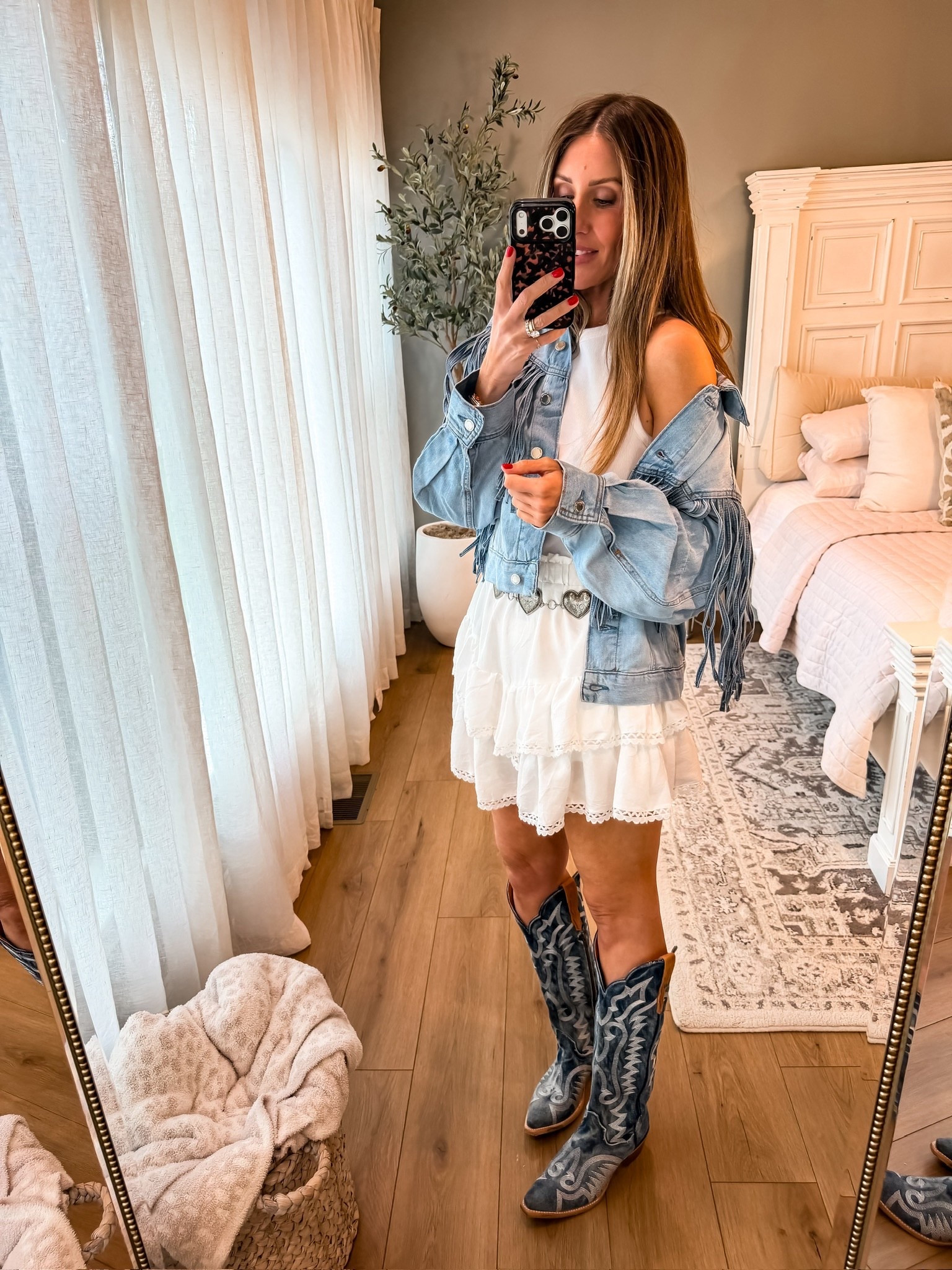 This one is GOOD 🤍 Denim jacket, flowy white skirt, and these boots… it’s giving western but still so feminine and easy. The fringe detail just makes it feel a little extra

western outfit, denim jacket, cowboy boots, summer outfit inspo, feminine western style, themominstyle 

#LTKootd #LTKTravel #LTKSeasonal