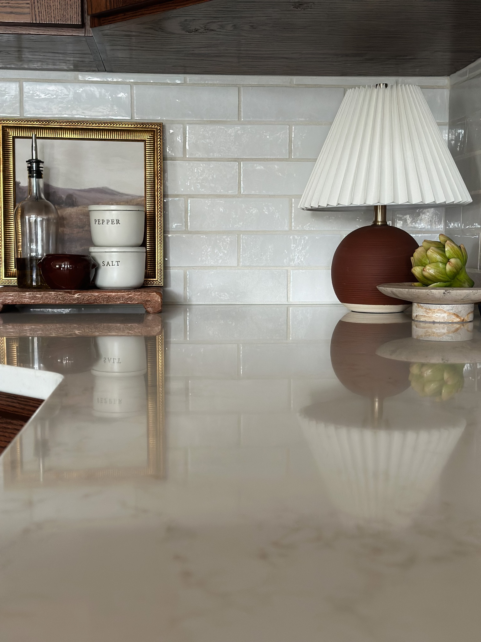 Kitchen renovation reveal!

Use code HAMANNS for 10% off your tile order!

Walnut kitchen cabinets, kitchen inspo, Alexander James ceramic white handcraft tile, white kitchen backsplash, Zellige tile, white quartz countertops, vicostone Aspen, studio McGee brass framed art, pleated lamp shade, salt cellar, wood pedestal, faux artichokes, marble pedestal, home decor

#LTKhome #LTKFind #LTKstyletip