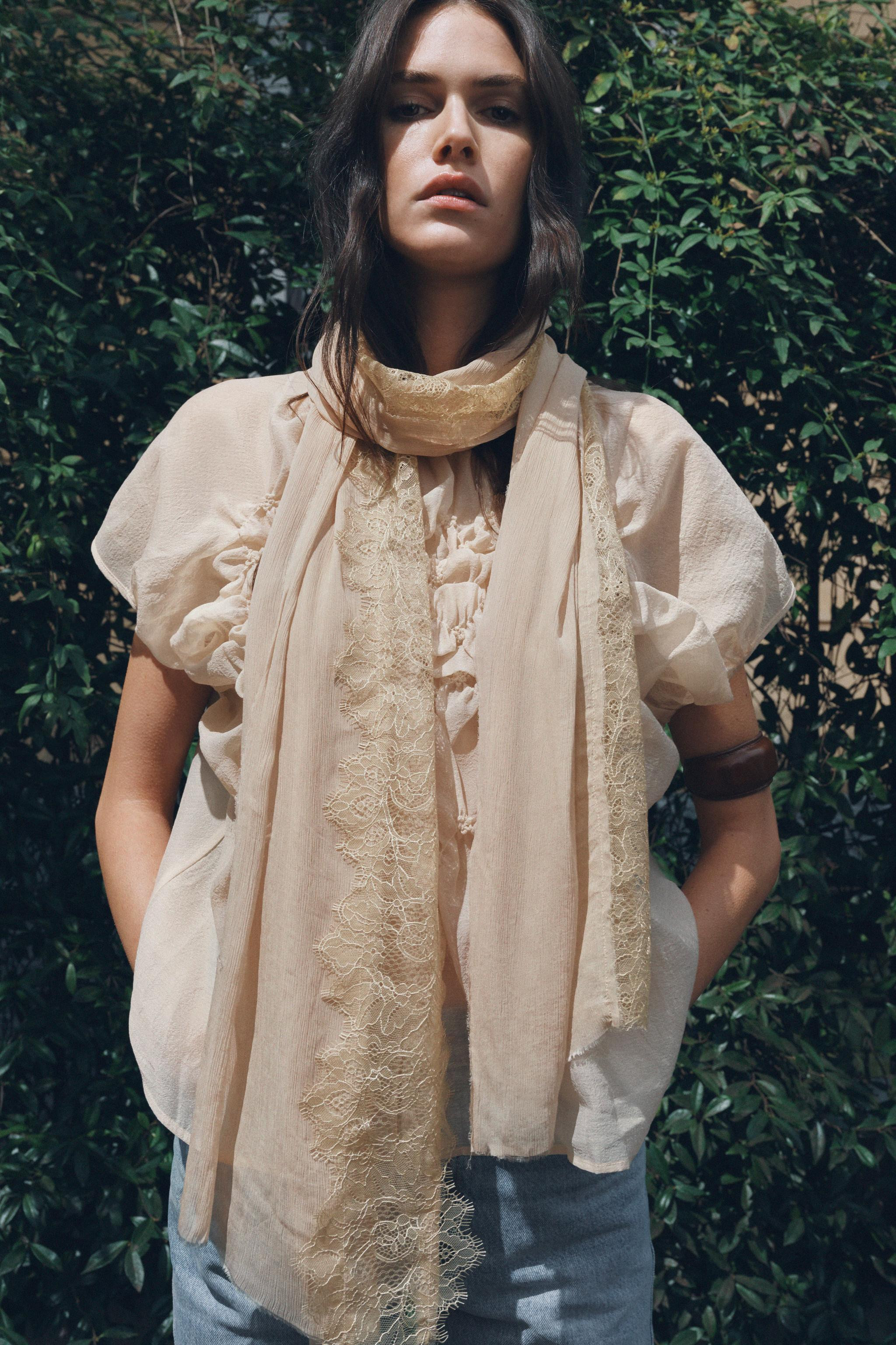 Semi-sheer top. Round neck with tonal lace trim. Cap sleeves with pleats. Stretch honeycomb fabri... | Zara US