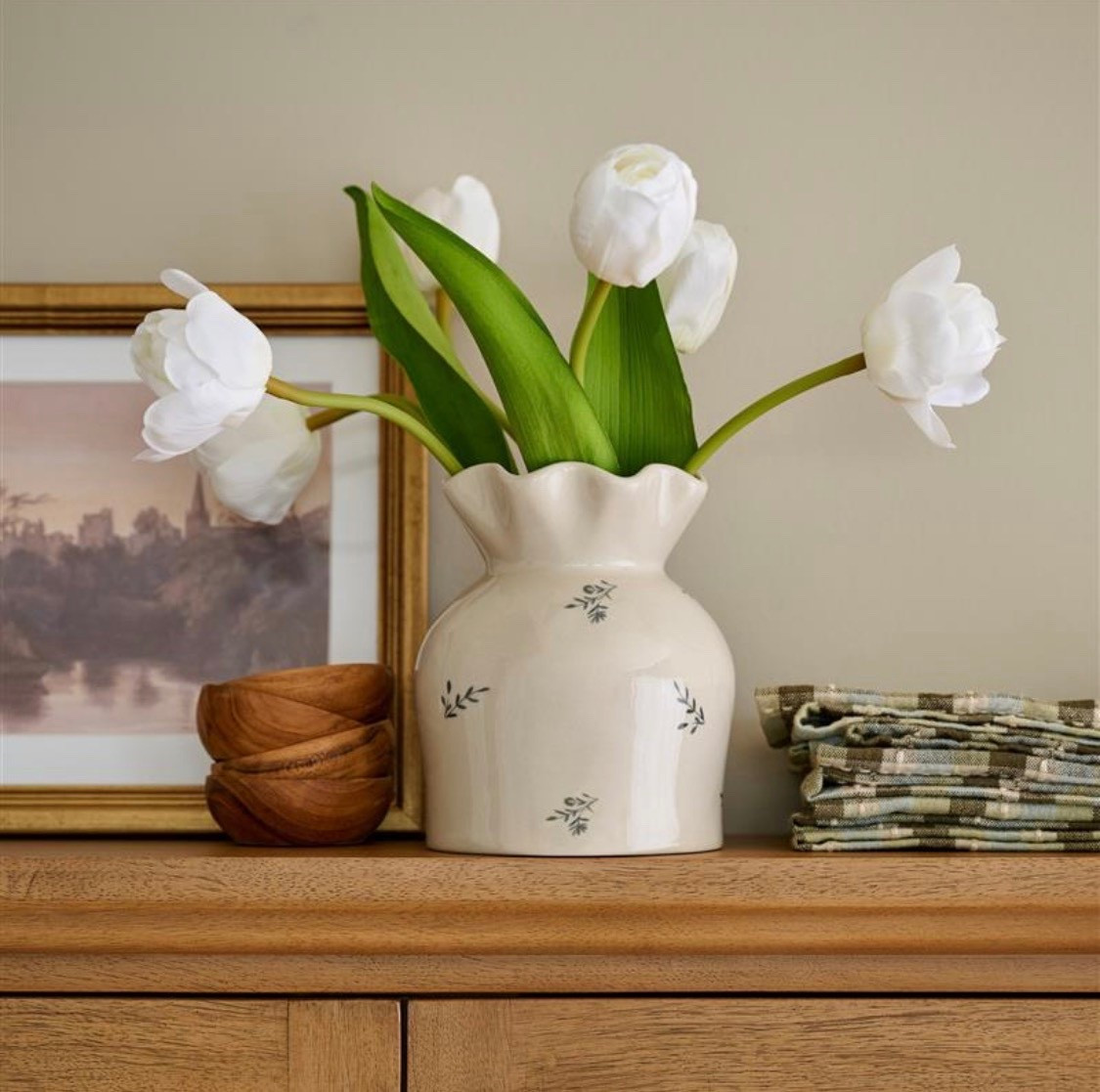 Refresh your home with the Jane Floral Vase Tulip Pairing, a sophisticated ensemble that brings together refined design and natural beauty. This curated collection features a scalloped vase paired with pristine white tulips, creating an effortless statement piece for any room. The timeless combination of curved lines and fresh florals offers a graceful way to brighten your décor while celebrating botanical elegance

#LTKValentine #LTKHome #LTKselfcare