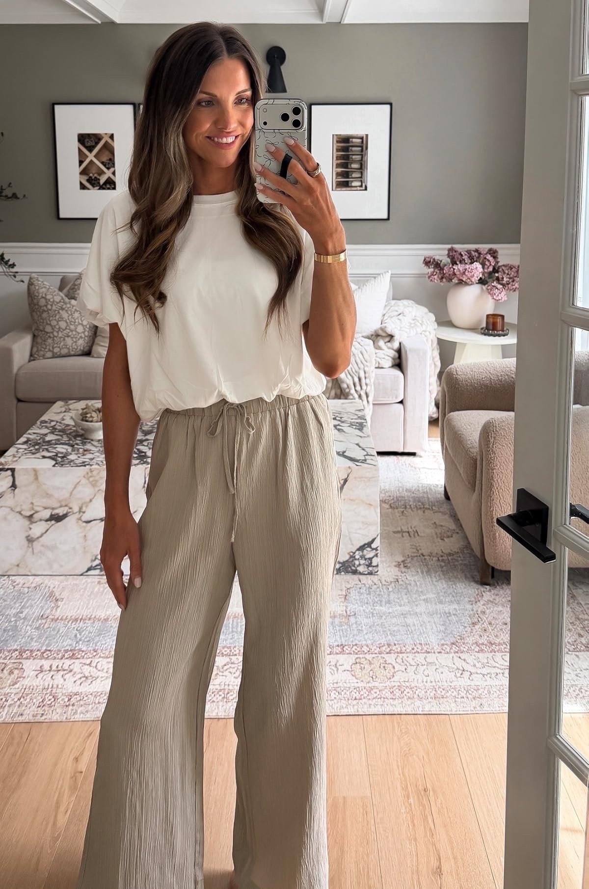 Highly impressed by these drawstring pants. They are identical to Aritzia, but a fraction of the price! They are so flattering, comfortable, and the perfect length! I’m wearing a size small and I am 5’ 9”! This white bubble top is also so good—a top seller recently!

#LTKgrwm #LTKootd