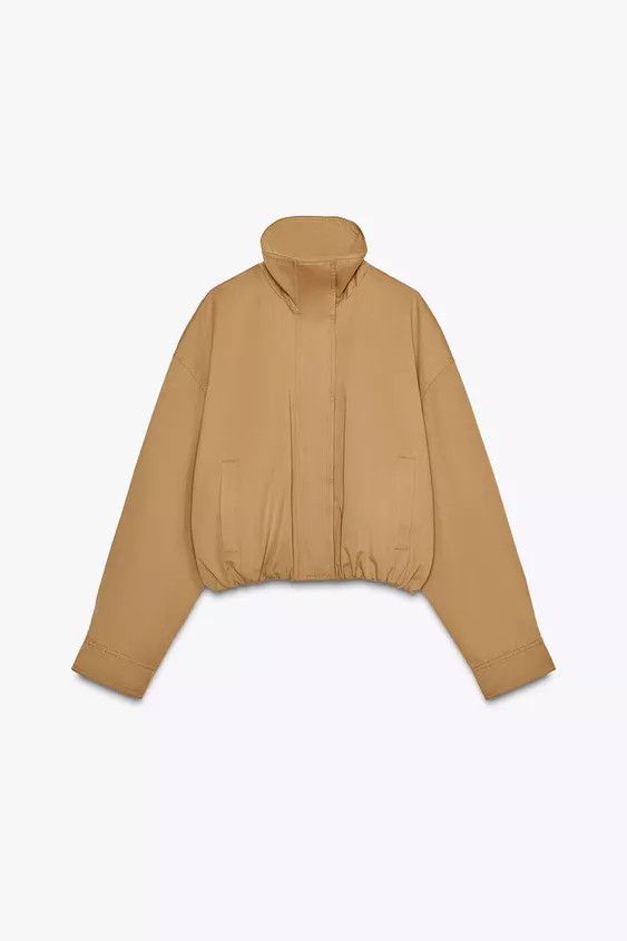 High-neck, long-sleeved jacket with pleated cuffs. Side pockets. Lined. Elasticated, gathered hem... | Zara UK