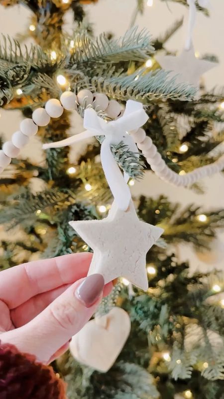Some salt dough ornaments, mixed with wood ornaments and garland 👌🏻 A pretty lovely minimalist tree. This is a king noble fir from @kingofchristmas and I could not love it more. Does it need ribbon? 

#LTKHoliday #LTKSeasonal #LTKhome