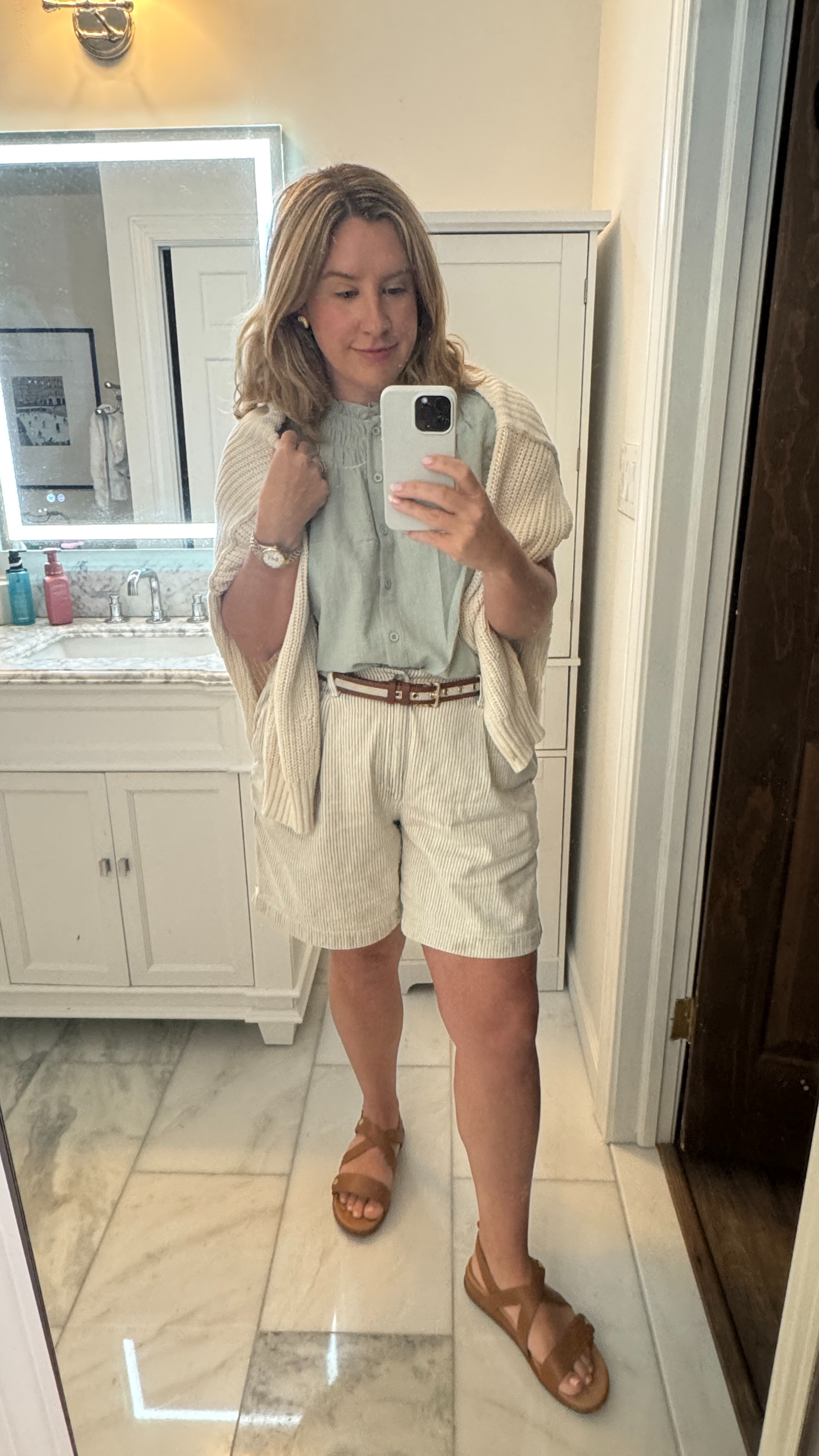This top and these sandals were perfect for our Paris vacation! Sadly, the shorts and cardigan are no longer being sold. Summer outfit inspiration, lightweight summer clothes, classic summer outfit, classic style, classic fashion, travel fashion, walking shoes, walking sandals 

 #LTKMidsize #LTKFindsUnder50 #LTKStyleTip