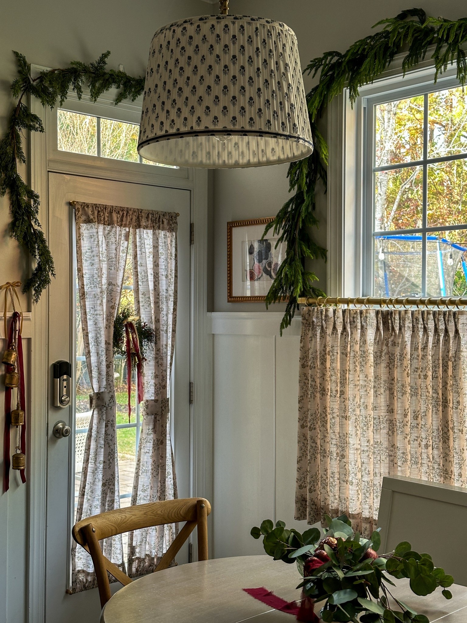There’s something about garland draped around a doorframe that just feels storybook — simple, timeless, and a little magical. 🎄
___
Christmas door garland, cottage entryway holiday, christmas bells decor, kitchen nook, holiday styling, holiday home decor, French door curtains, cafe curtains, garland, wreath on door 
_
#LTKHolidayHome #ChristmasGarland #FestiveDoorway #CottageDecor #kitchendecor #christmasdecor #holidayhomedecor 

#LTKHome #LTKSeasonal #LTKHoliday