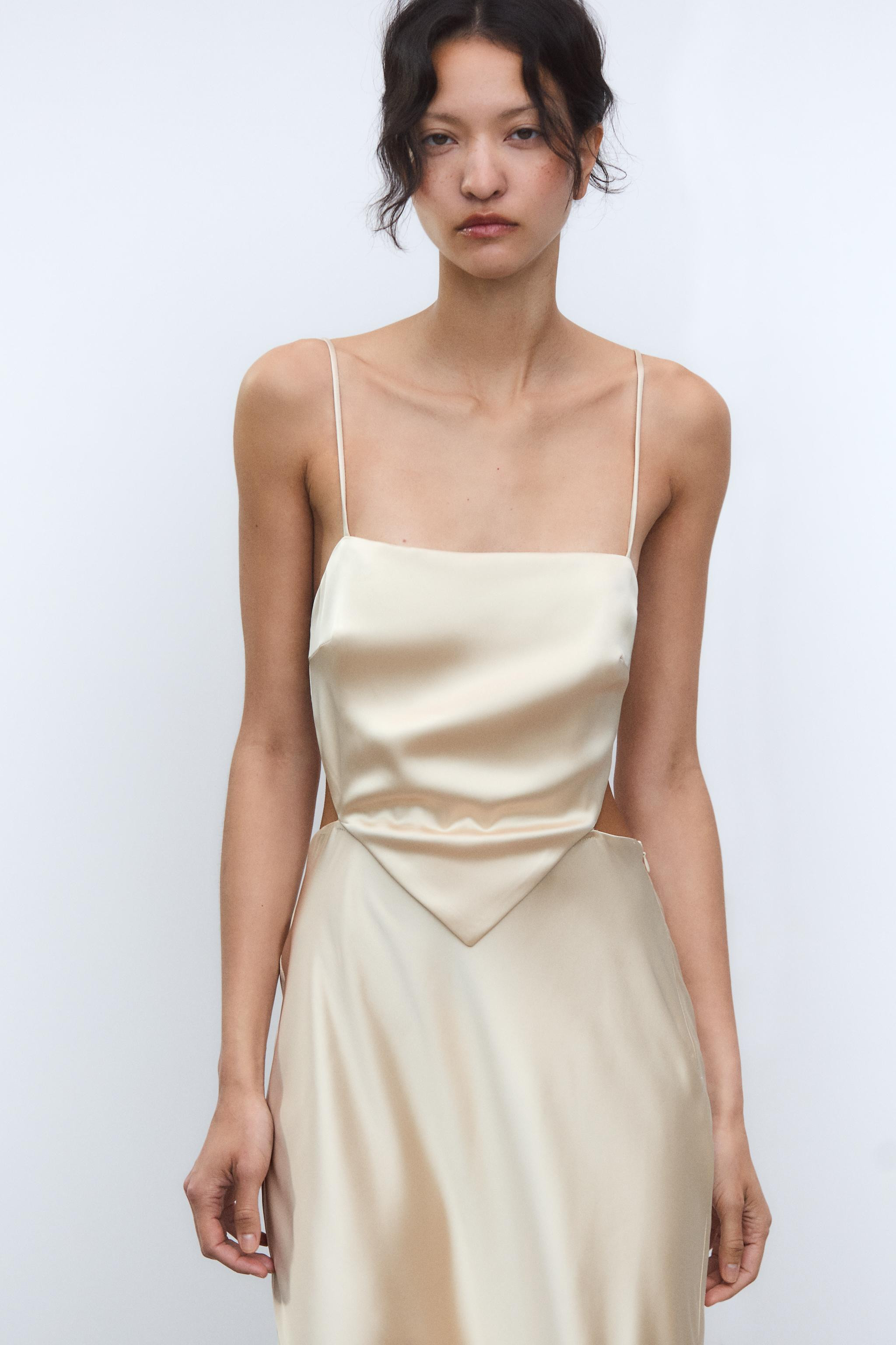 Satin midi dress. Straight neckline and adjustable spaghetti straps. Wrap bodice with V-neck. Ope... | Zara US