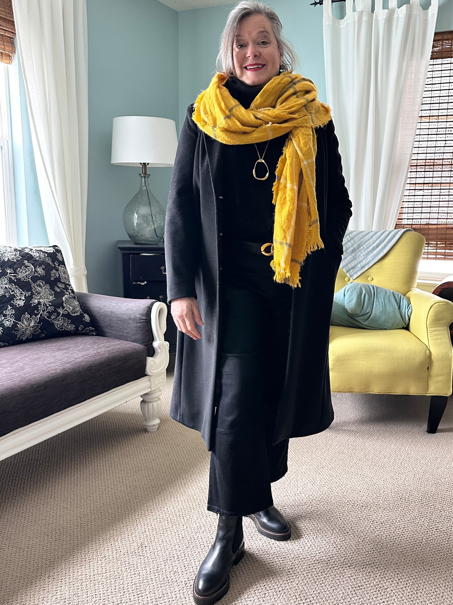 Black pants, black turtle neck with long black coat and yellow scarf 
#fashionover50 #styleatanyage 

#LTKMidsize