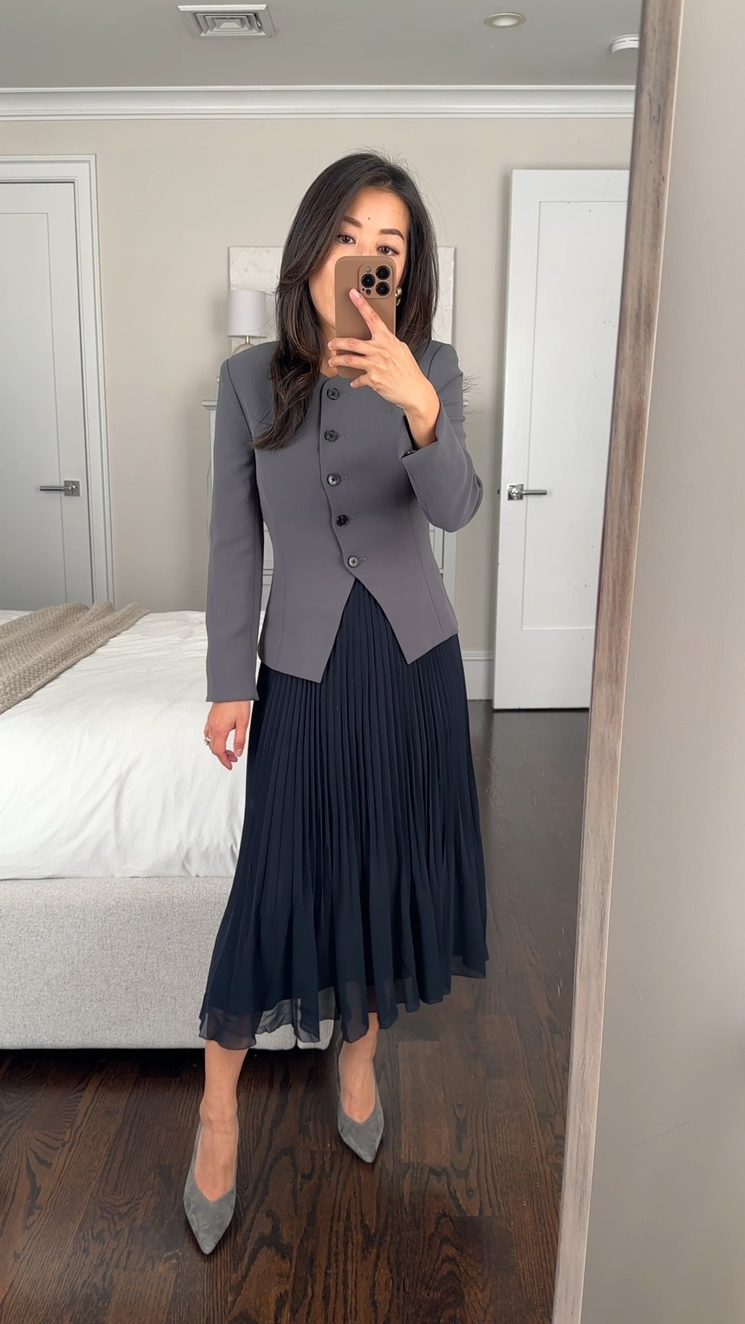 Aritzia try ons 

• Regal blazer in cool gray 00 - this is the jacket version of the regal vest I love! 

Sharp workwear piece or paired with denim for 

The jacket cut is fitted and slim, I’m between sizes as 00 is a snug fit and 0 is a little loose, but this is a 00. Sleeves fit long on me - I have 2 inches folded under here. 

Comes in matching colors in the effortless cropped or full length pant. I wear Shorter in the full length effortless trouser since it runs long

• Twirl pleated skirt in navy xxs - so pretty! Midi length on petites. More feminine , lightweight and flowier than the average pleated skirt. 

I have a 25” waist and prefer the xxs to sit higher at my waist. Xs measures 12.25” across the elastic waist band and has stretch  

• old AT pumps 

@aritzia #AritziaPartner

#LTKStyleTip #LTKWorkwear #LTKSeasonal