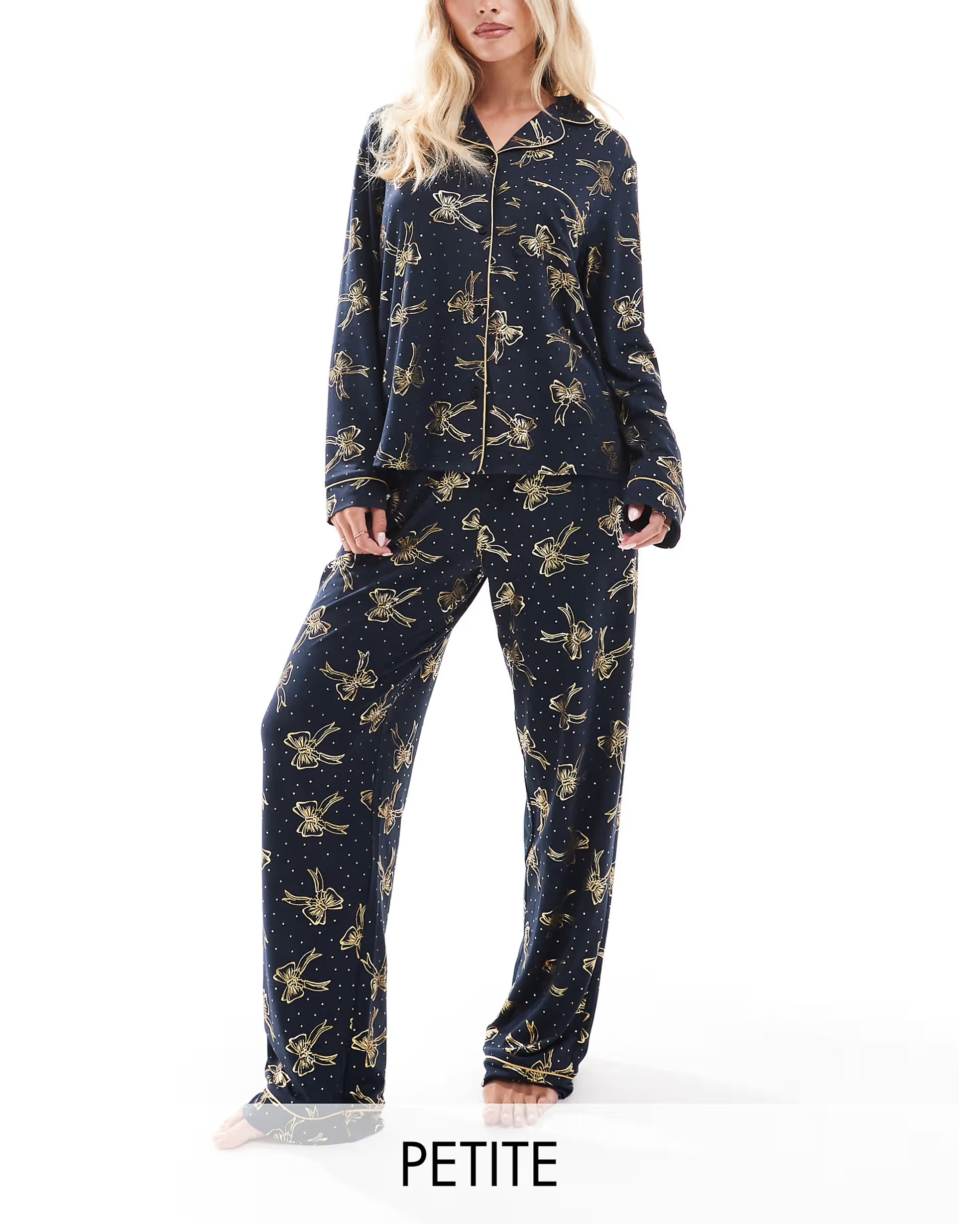 Chelsea Peers Petite poly Christmas foil bow print long sleeve revere and trouser pyjama set in n... | ASOS (Global)