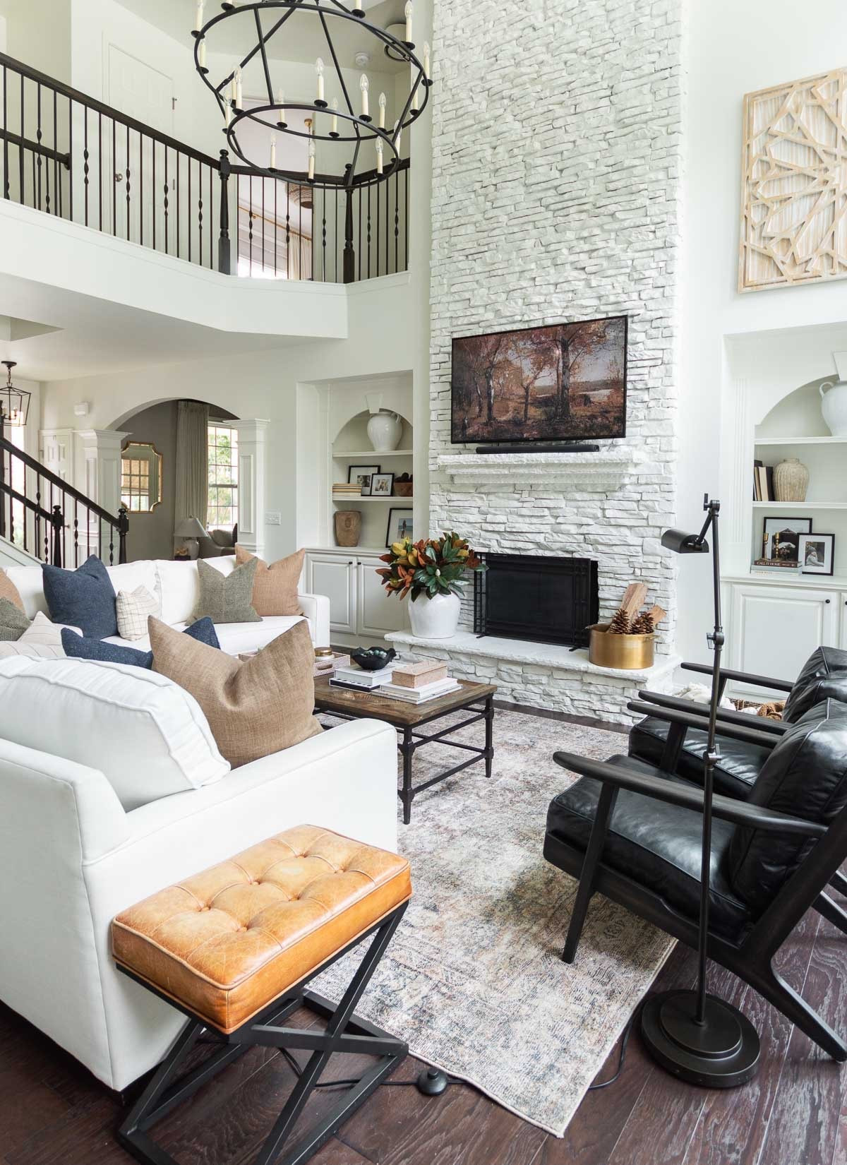 I typically keep seasonal decor to a minimum, but the changing of the seasons is a great time to add a new accent or two, like these dark blue and striped pillows. I also like to stream seasonal art on my tv! home decor fall decor living room decor neutral living room area rug black leather chair pottery barn sofa#LTKStyleTip

#LTKHome #LTKSeasonal