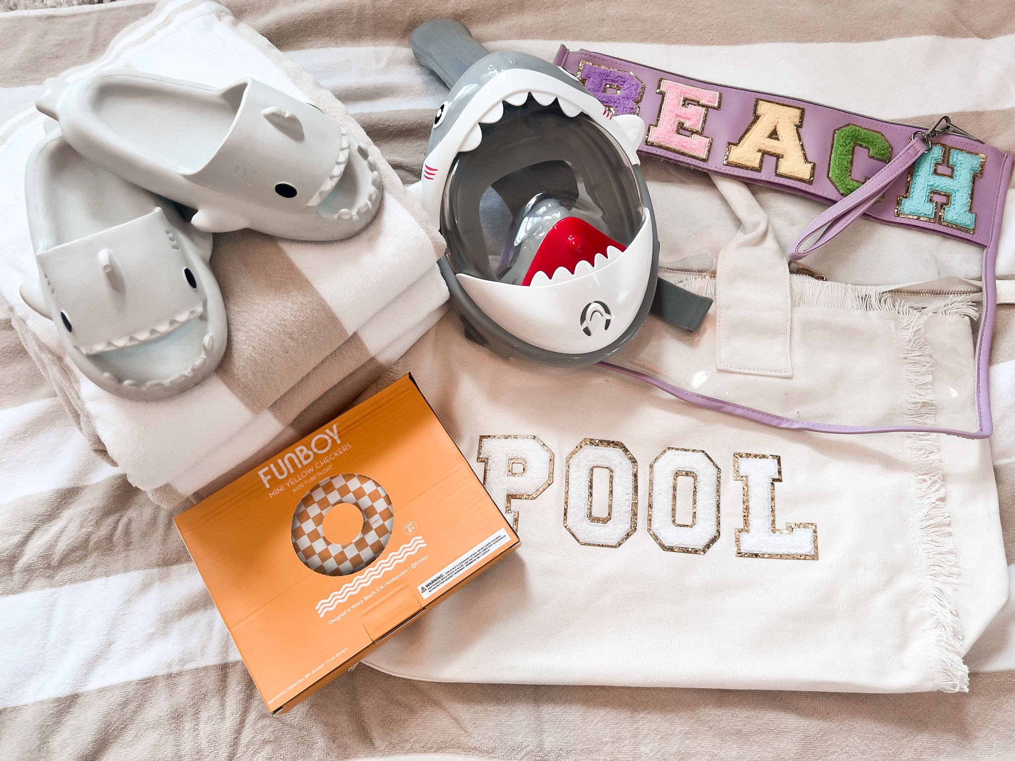 Beach patch bag 
Kids shark sandals
Kids shark snorkel masks 
4 pack beach towels 
Checkered pool float 