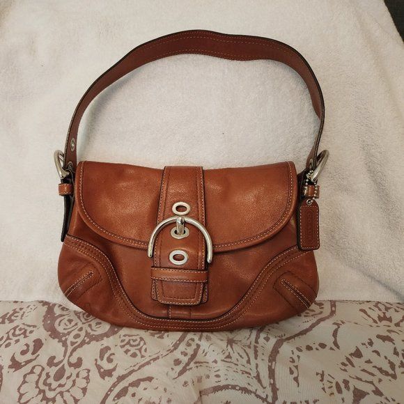 Stylish Coach brown leather purse with front pocket and silver metal clasps | Poshmark