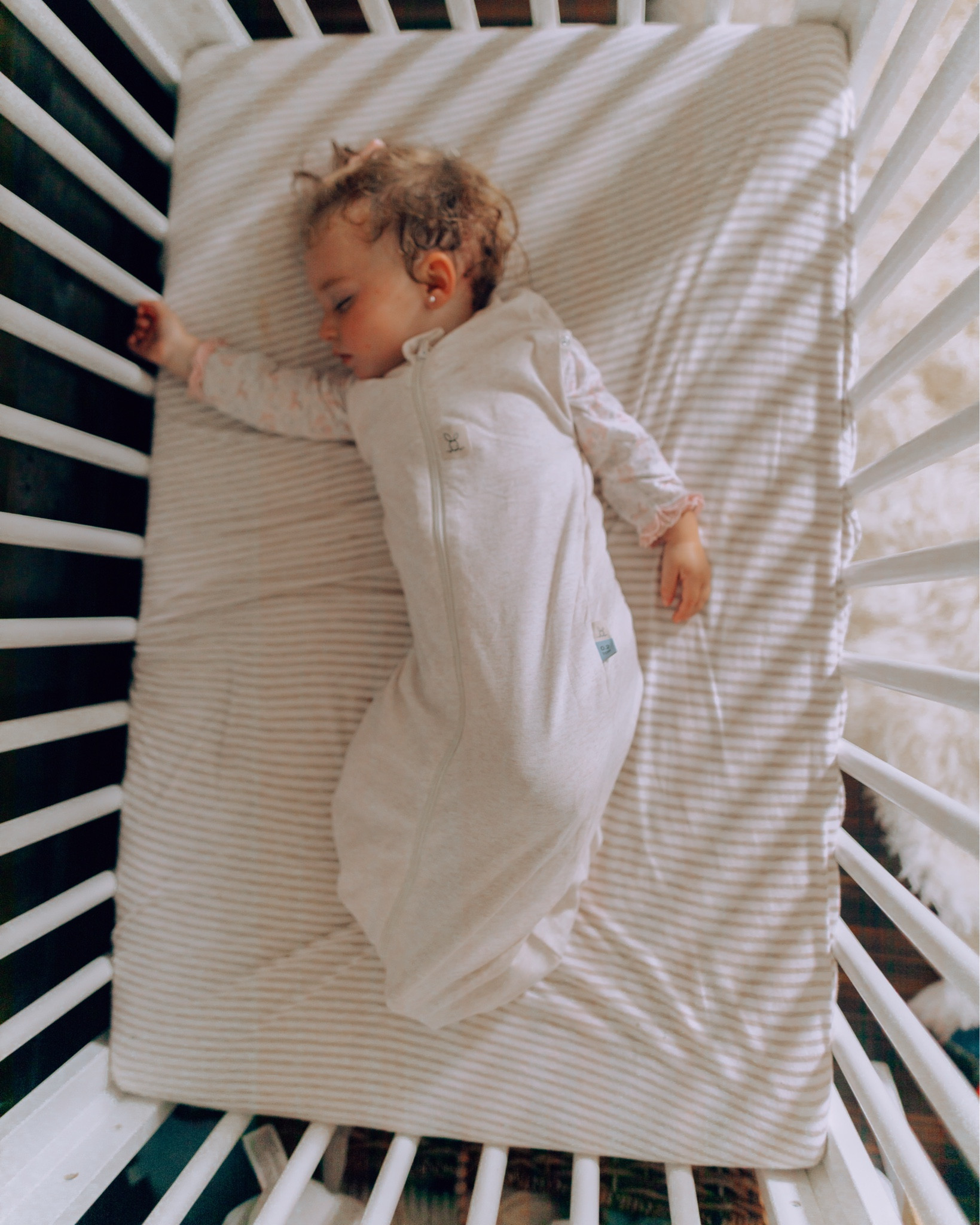 Baby Items I’ve Loved as a Second-Time Mom: SLEEP EDITION
I now swear by ErgoPouch sleep sacks and wish we had used the is with my first— it’s been a total game changer with my second baby for easier bedtimes and more sleep. She hated being swaddled after just a few weeks, so I started looking for something to support better sleep—and these have been it.

They grow with your baby during the different transitions to arms out and rolling, and my daughter instantly knows it’s time for bed when we put hers on. Since using them, she’s been sleeping so much longer through the night.

What I love most?
* Different TOG weights for every season
* Soft, organic jersey cotton in so many cute patterns
* Bell-shaped bottom for healthy hips
* 2-way zipper for easy nighttime changes
* Their genius butterfly cardi was the perfect addition in the first few months for that arms-in to arms-out transition and still supporting the newborn startle reflex without being swaddled
They’ve made bedtime easier, smoother, and so much more consistent as she has been growing. I’m obsessed. All the details are linked below! 💤✨

#LTKBump #LTKBaby