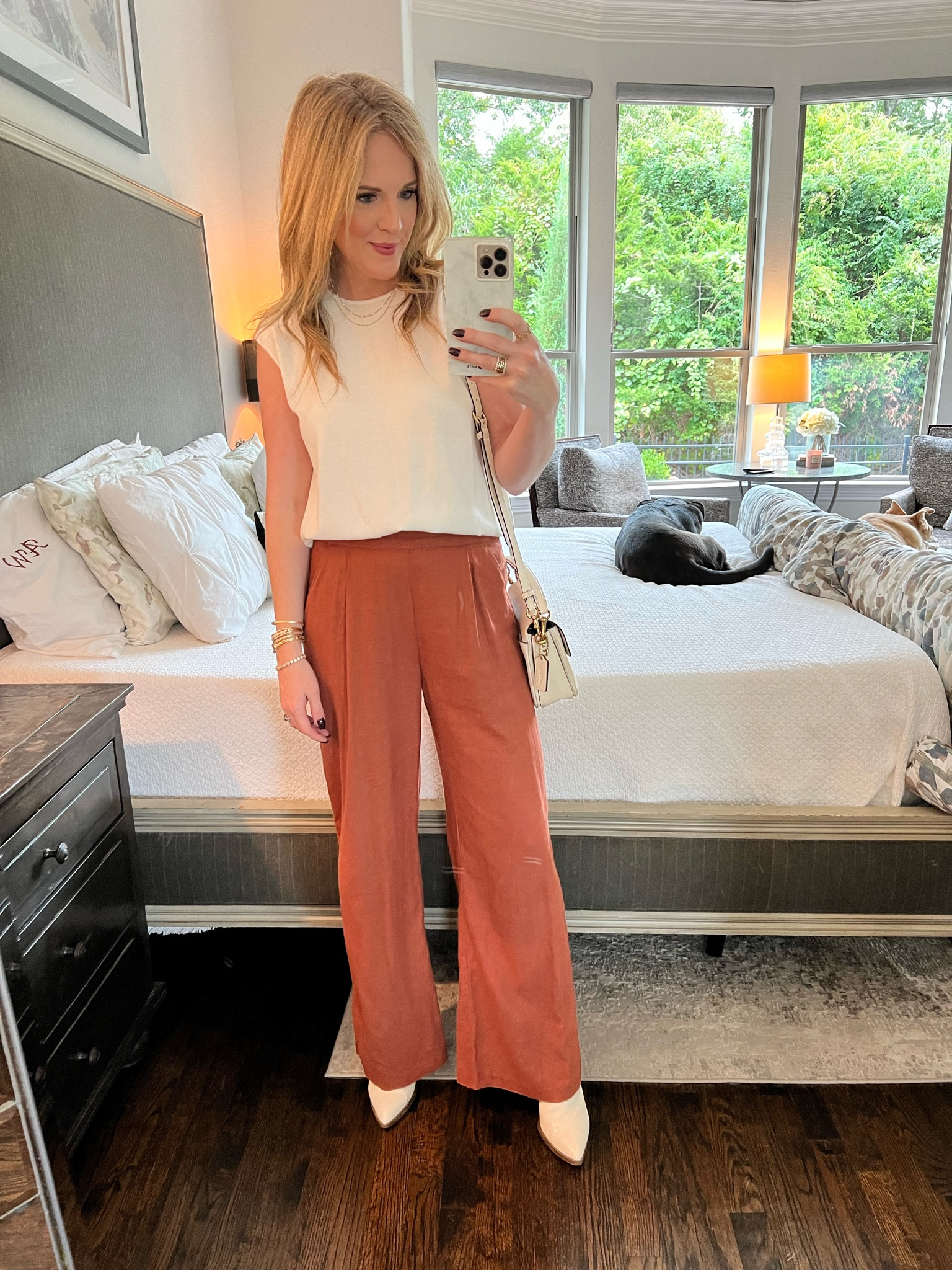 Work wear look 
Business casual look 
Banana republic sweater tank 
Orange wide leg pants 
Linen wide leg pants 
White booties 
Fall transition look 
Fall look 
Pumpkin spice 
Coach bag 
White bag 

#LTKSeasonal #LTKsalealert #LTKworkwear